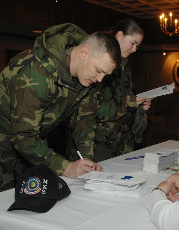 Master Sgt. Jesse Hilderbrand, 55th Maintenance Squadron, and Staff Sgt. Kellie Herman, 55th Maintenance Group, fill out AFAF donation forms. The event raised $1,985 towards Offutt’s goal of $104,242. Offutt's AFAF campaign runs through May 2. To make a donation to the AFAF, contact unit key workers or Master Sgt. Jason Heiden at 294-5270. (U.S. Air Force Photo/Dan Rohan)