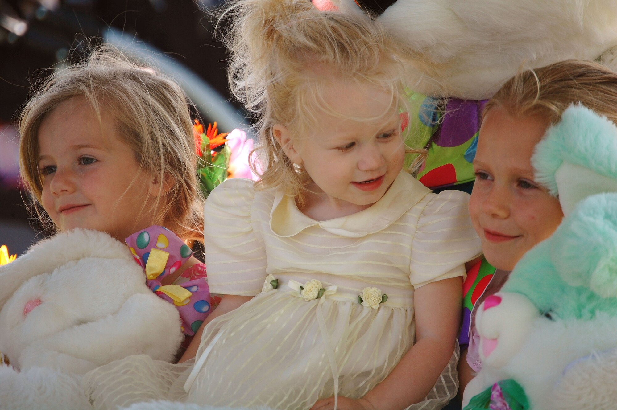 LAUGHLIN AIR FORCE BASE, Texas – Three young girls prepare to take a photograph with the Easter bunny at Laughlin Youth Center’s Annual Spring Family Day March 22. “There were nearly 500 individuals that came to the event,” said Ray Torres, Youth Center director.   (U.S. Air Force photo by Airman Sara Csurilla)