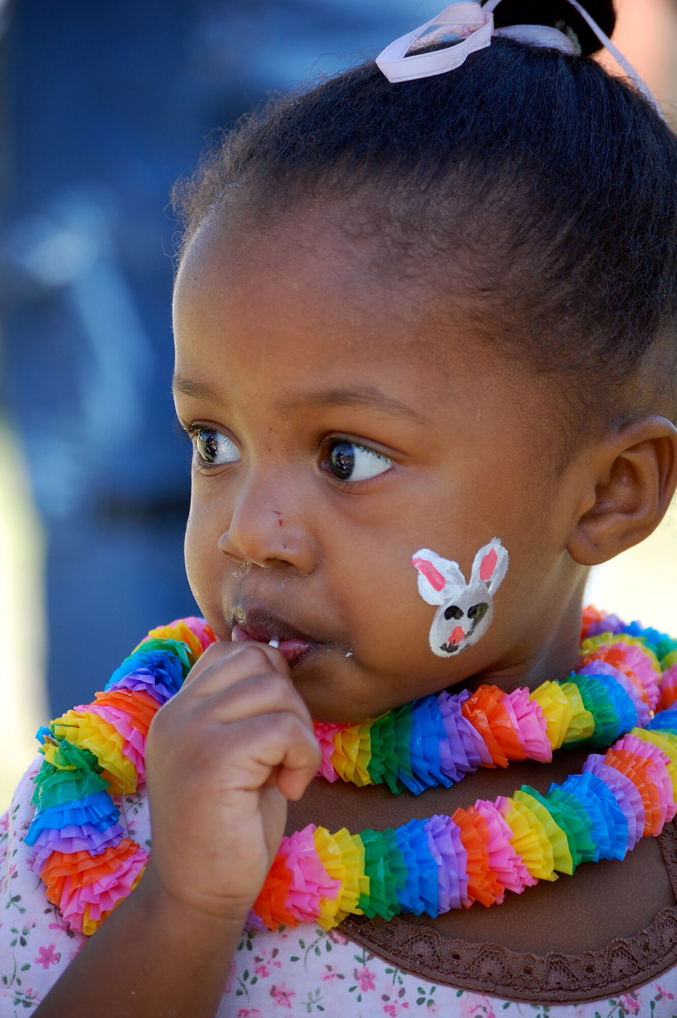 LAUGHLIN AIR FORCE BASE, Texas – Kalia Ahmad, daughter of Senior Airman Nasir Ahmad, 47th Security Forces Squadron and Abbra Ahmad, enjoys a lollipop she won playing one of the many games at Laughlin Youth Center’s Annual Spring Family Day March 22. The family day began with a parade that ran from the base chapel to the picnic grounds and continued with an egg hunt and other family oriented games. (U.S. Air Force photo by Airman Sara Csurilla)