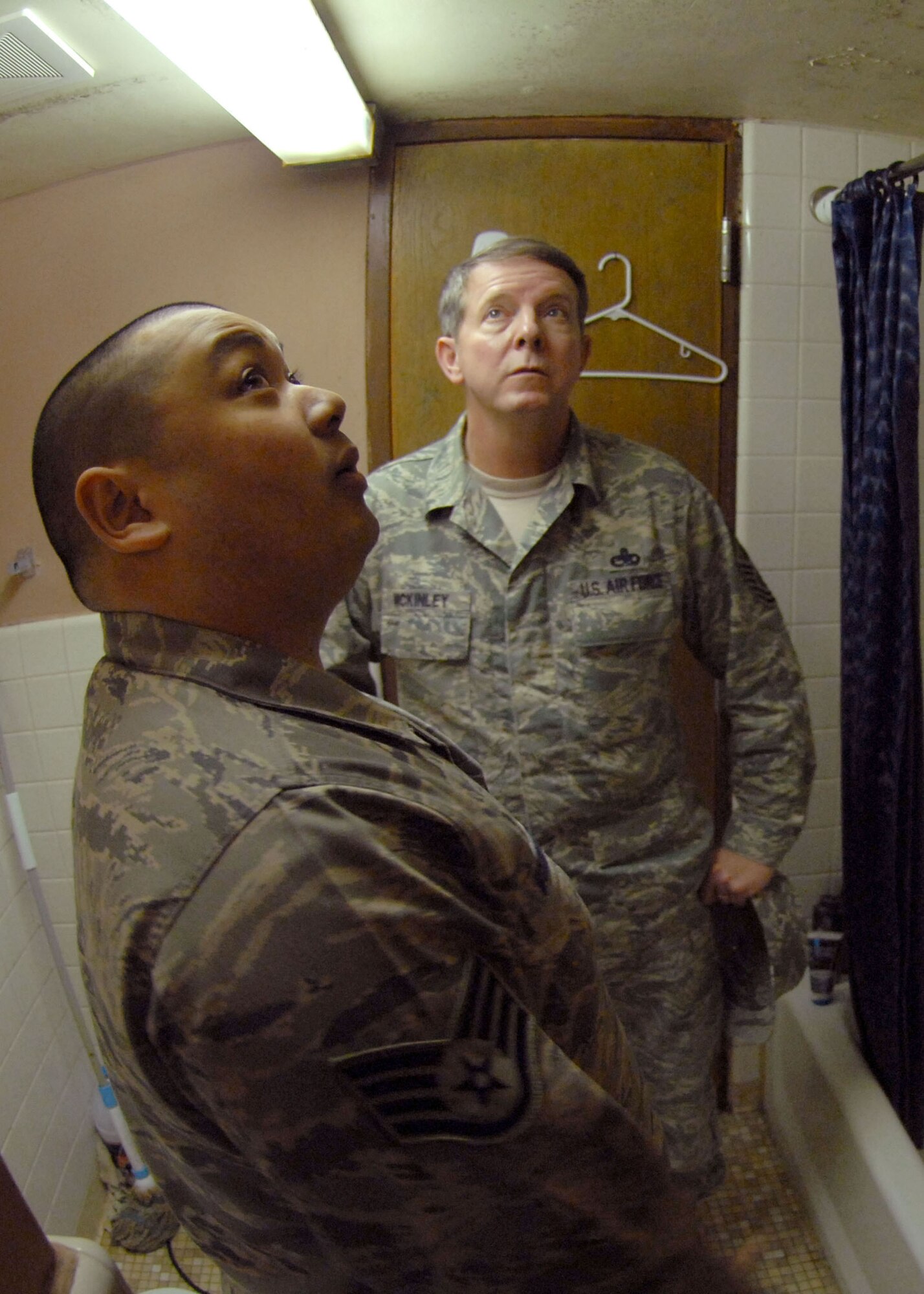 Staff Sgt. Jamin McCremens shows Chief Master Sgt. the of Air Force Rodney J. McKinley dorm conditions during the chief's March 24 visit to Kunsan Air Base, South Korea. Sergeant McCremens is an 8th Civil Engineer Squadron dorm manager. (U.S. Air Force photo/Staff Sgt. Araceli Alarcon) 

