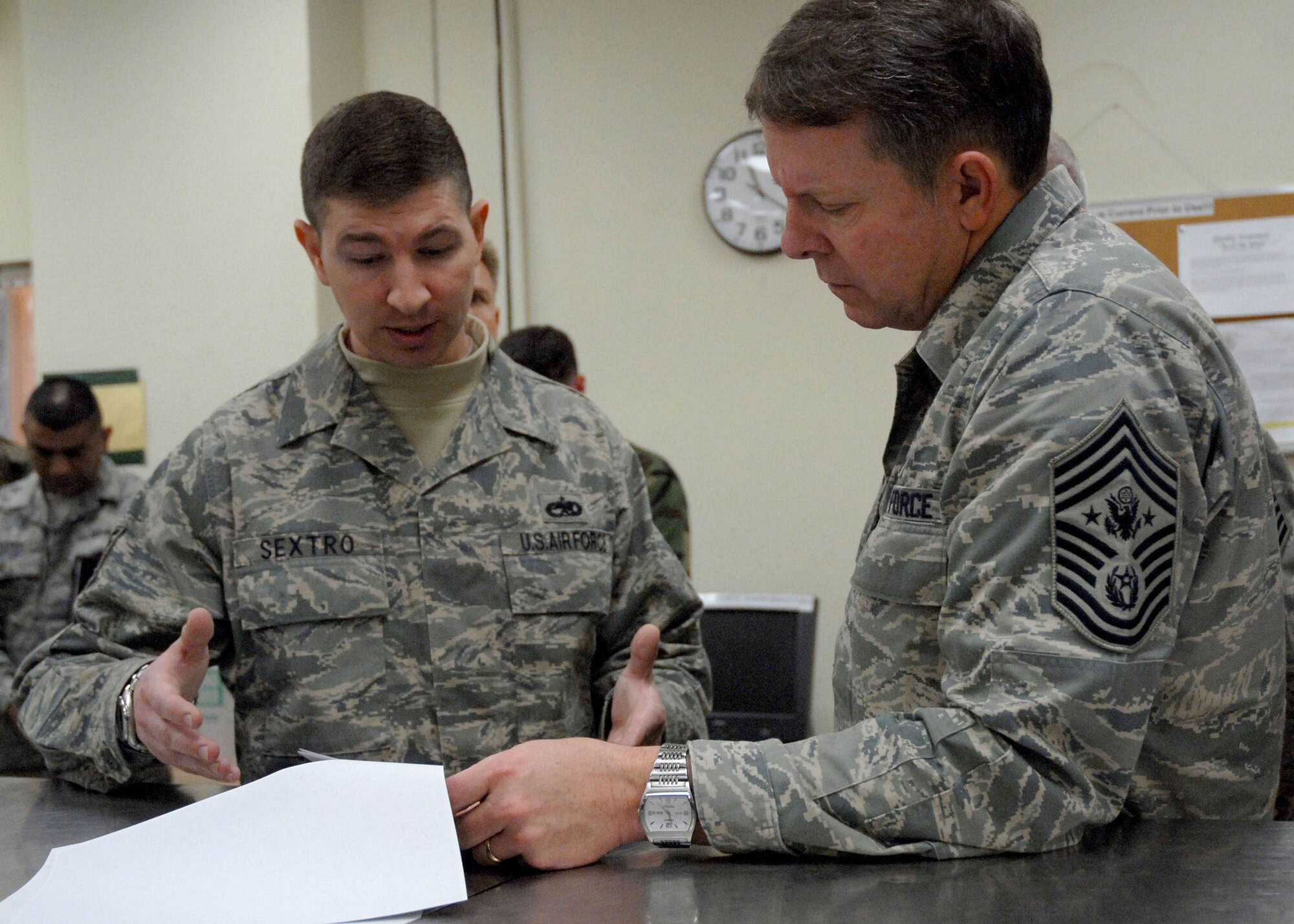 Tech. Sgt. Michael Sextro briefs Chief Master Sgt. of the Air Force Rodney J. McKinley about intake rippling on F-16 Fighting Falcons during the chief's March 24 visit to Kunsan Air Base, South Korea. Sergeant Sexton is assigned to the 8th Aircraft Maintenance Squadron. (U.S. Air Force photo/Staff Sgt. Araceli Alarcon) 
