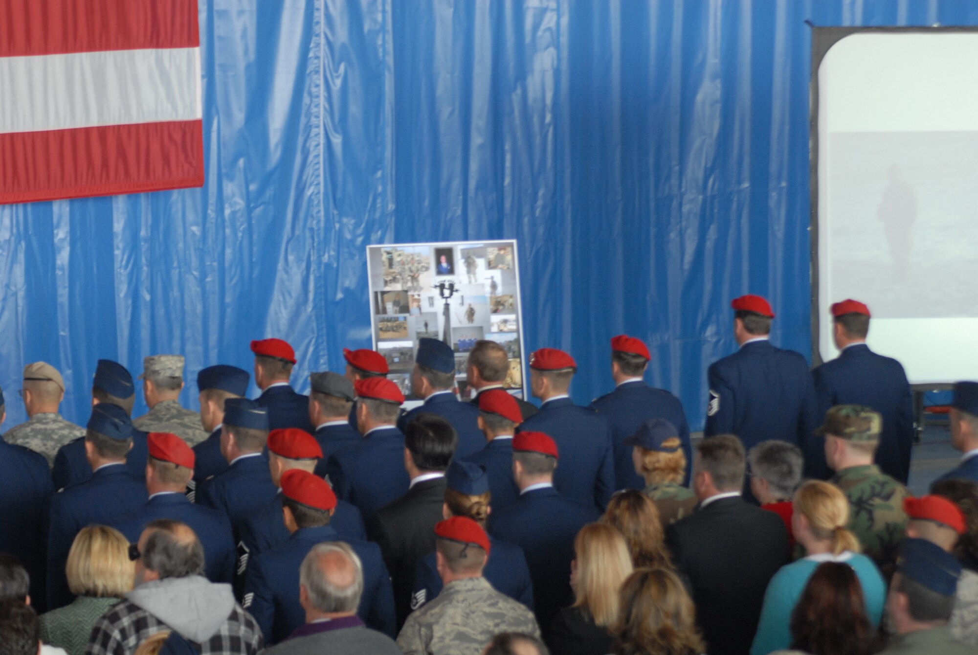 Mourners look on during the memorial ceremony for Tech. Sgt. William Jefferson Jr., 21st Special Tactics Squadron, at Hangar 4 on Pope March 26. Sergeant Jefferson died in support of Operation Enduring Freedom March 22. (U.S. Air Force Photo by 2nd Lt. Chris Hoyler)