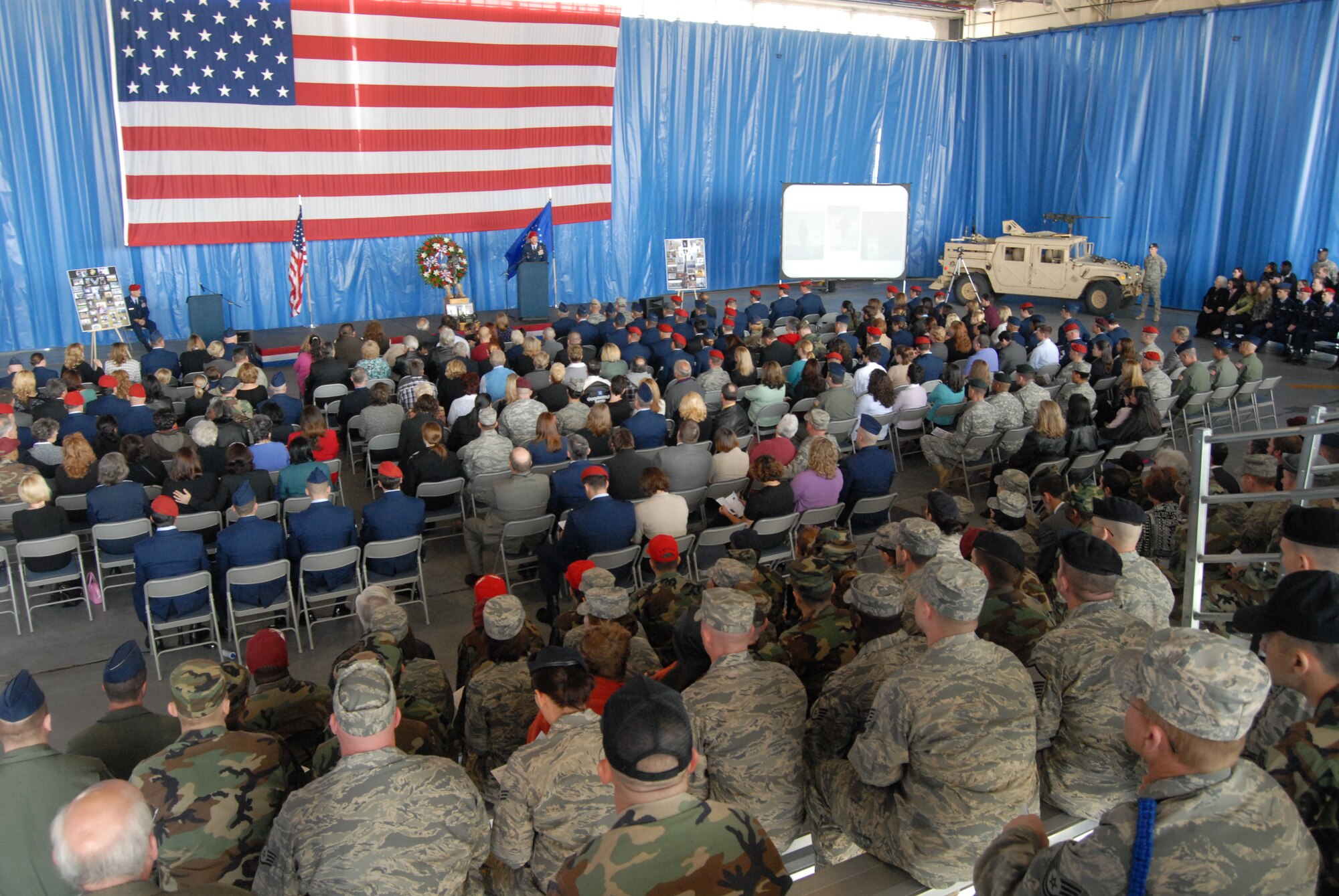 Mourners look on during the memorial ceremony for Tech. Sgt. William Jefferson Jr., 21st Special Tactics Squadron, at Hangar 4 on Pope Air Force Base March 26. Sergeant Jefferson died in support of Operation Enduring Freedom March 22. (U.S. Air Force Photo by 2nd Lt. Chris Hoyler)