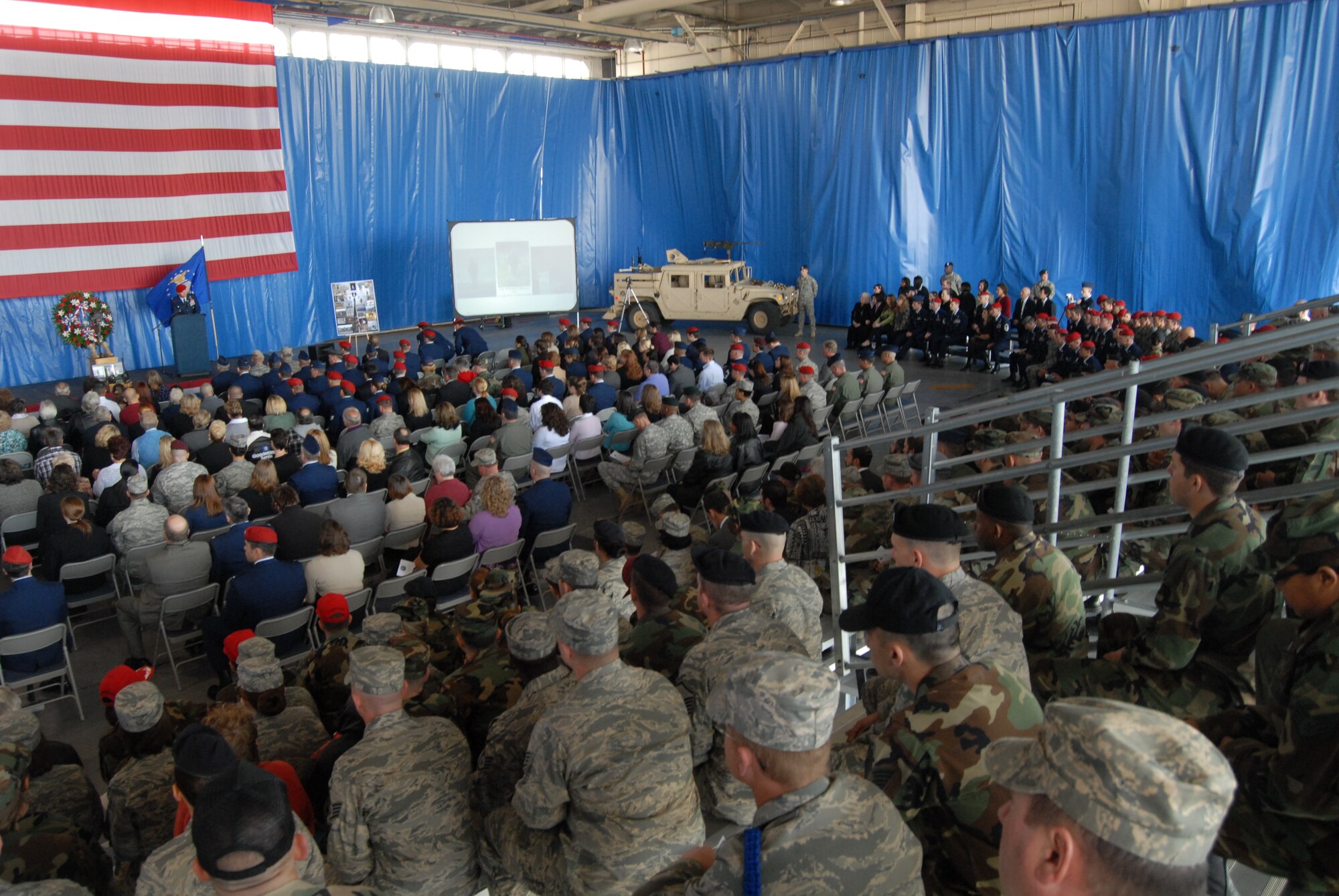 Mourners look on during the memorial ceremony for Tech. Sgt. William Jefferson Jr., 21st Special Tactics Squadron, at Hangar 4 on Pope Air Force Base March 26. Sergeant Jefferson died in support of Operation Enduring Freedom March 22. (U.S. Air Force Photo by 2nd Lt. Chris Hoyler)