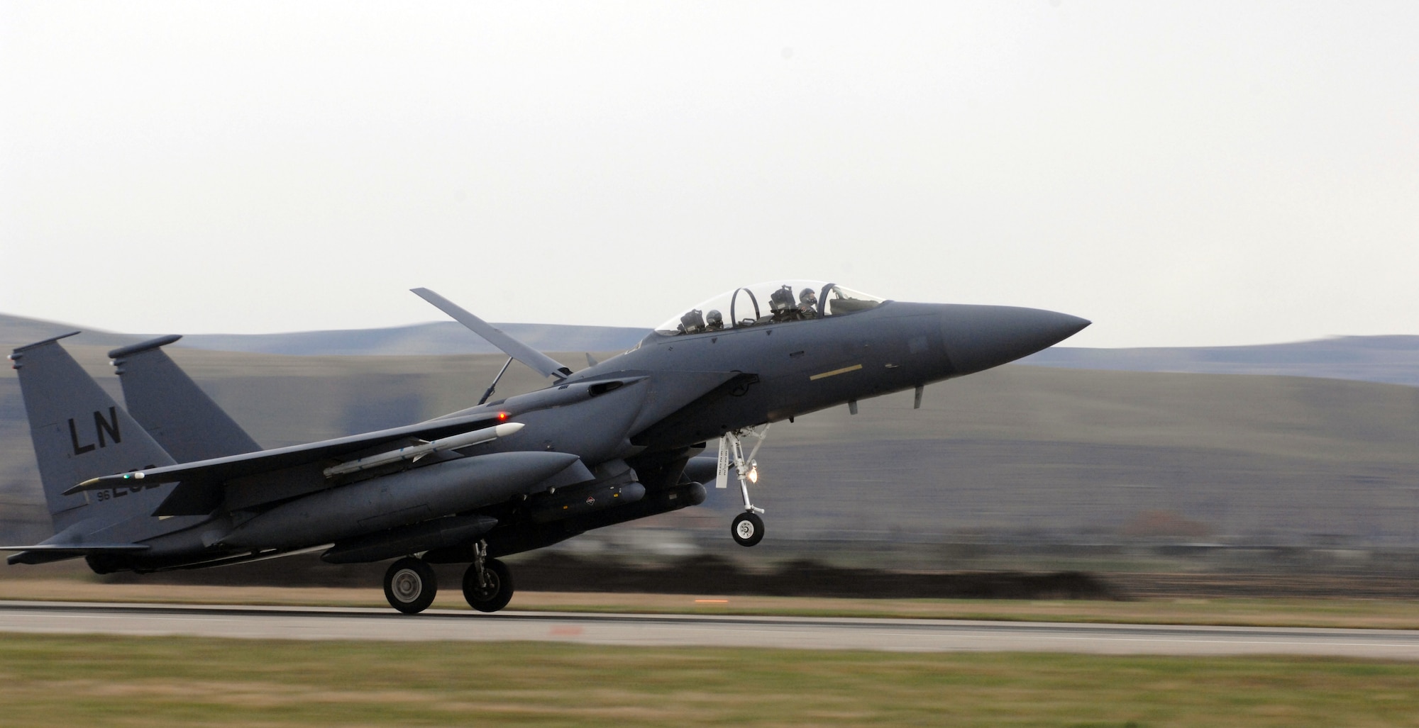 CAMPIA TURZII, Romania -- An F-15 from the 48th Fighter Wing at RAF Lakenheath, UK, arrives here today in support of the Air Force’s efforts to augment NATO air policing over Romania in support of the NATO Summit April 2-4.”  The summit will host leaders from NATO member nations, including President George W. Bush.  (U.S. Air Force photo by Senior Airman Teresa M. Hawkins)