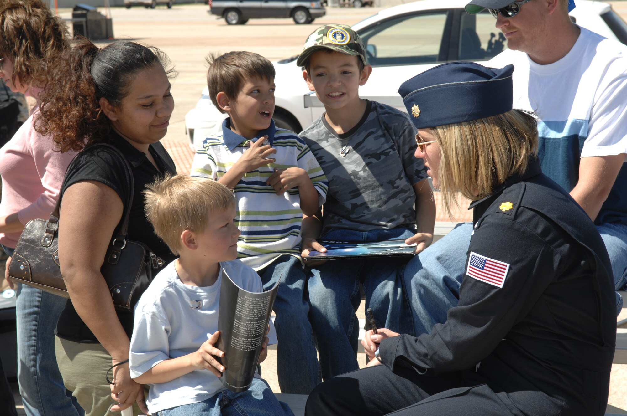 Major Samantha Weeks, Thunderbird lead solo pilot, talks with children from the Make-a-Wish Foundation and their families after the Thunderbirds’ practice performance March 14. Children and families from the Make-a-Wish Foundation were special guests of the Thunderbirds. (U.S. Air Force photo by  Staff Sgt. John Barton)
