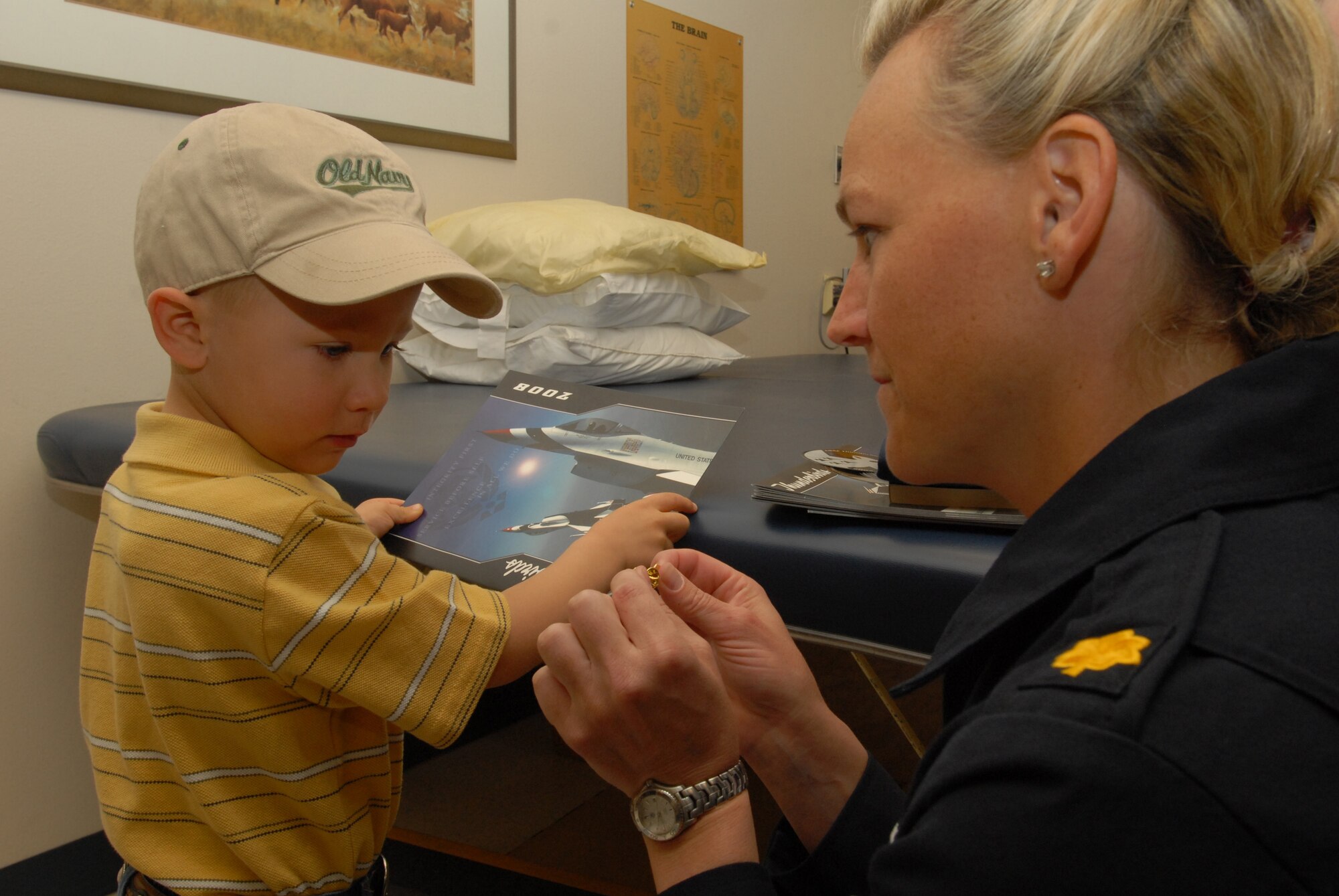 Braden Peiser, son of Erica Peiser, gets pinned by Maj. (Dr.) Charla Quayle during a Thunderbirds visit to San Angelo Community Medical Center in San Angelo, Texas. Dr. Qualye, flight surgeon for the entire Thunderbirds team, and several enlisted personnel spent time with patients, employees and family members as part of the teams visit to San Angelo for Air Fiesta ‘08.  (U.S. Air Force Photo by Master Sgt Randy Mallard)