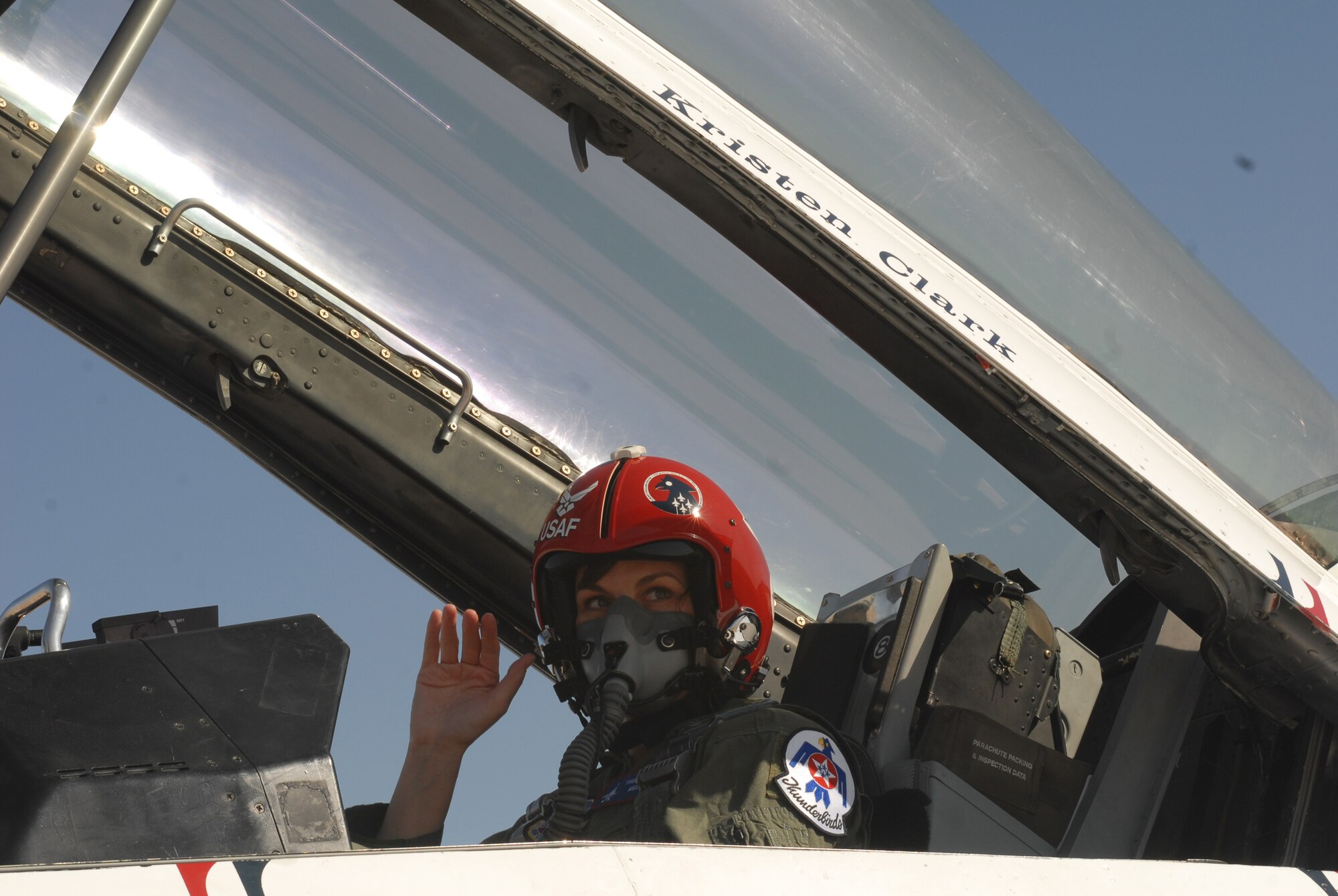 Kristin Clark, an anchor with KLST News in San Angelo, waves prior to her media flight March 13. Mrs. Clark was instructed in proper entry, exit and safety procedures for the F-16 Fighting Falcon prior to her flight, which helped the news anchor better tell the Air Fiesta ‘08 story. (U.S. Air Force photo by Master Sgt. Randy Mallard)