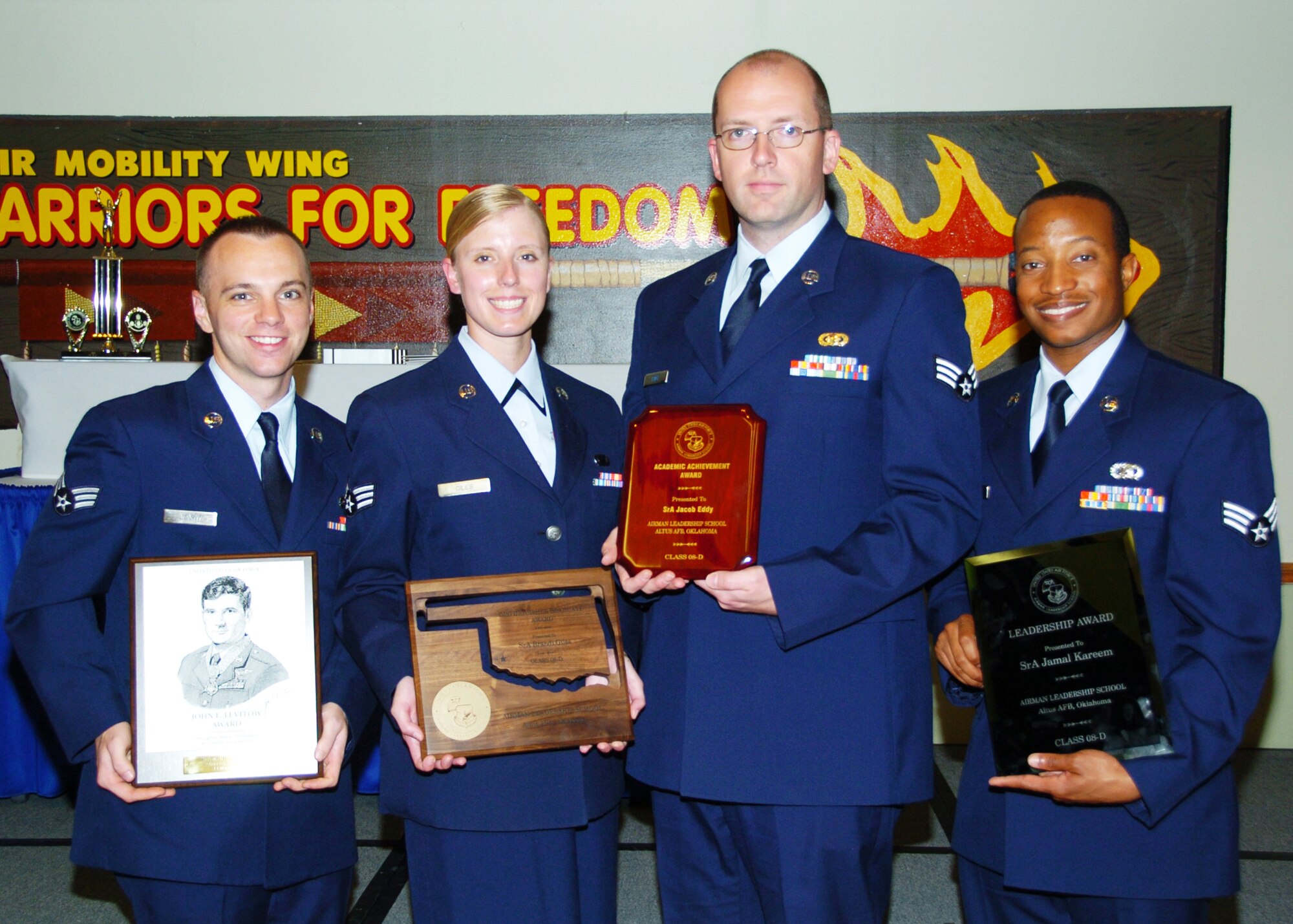 Airman Leadership School award winners (Class 08-D) pose for a group photo after a graduation ceremony. From left to right are Senior Airmen Michael Lavoy, Brandi Giles, Jacob Eddy and Jamal Kareem. All four Airmen are from different units from Goodfellow Air Force Base. (U.S. Air Force photo by Airman 1st Marianne Lane)