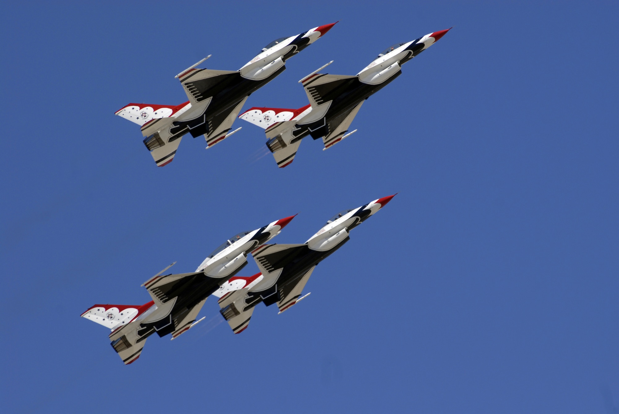 The Thunderbirds fly in diamond formation over Air Fiesta ’08 March 15. The Thunderbirds, headquartered at Nellis Air Force Base, Nev., are the Air Force’s premier aerial demonstration team, and Air Fiesta ‘08 marks their first air show in the 2008 season. (U.S. Air Force photo by Senior Airman Kamaile Chan).