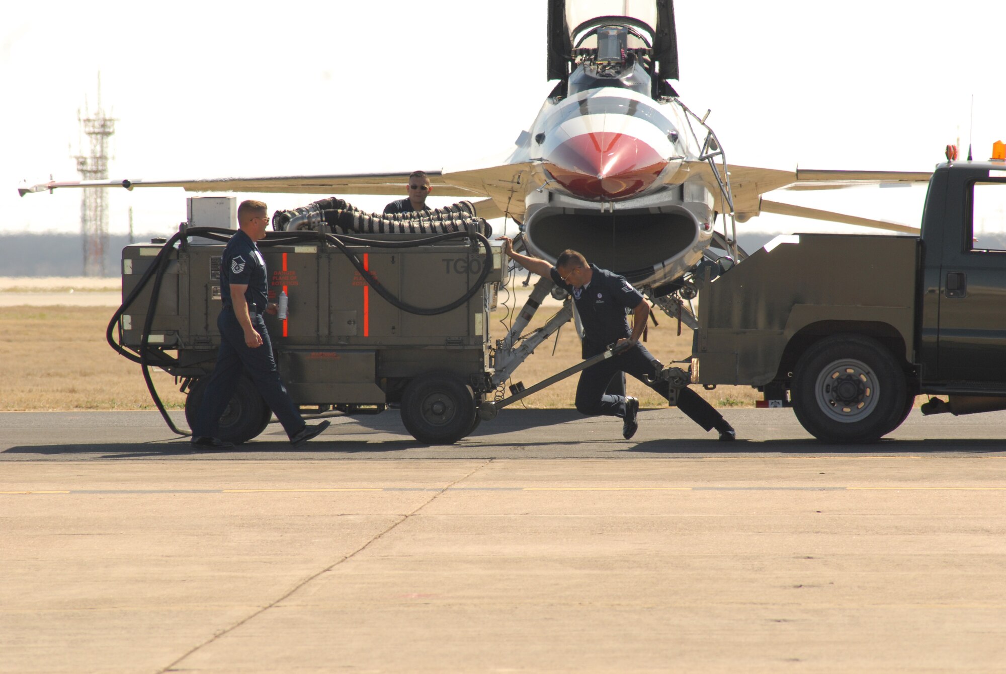 Enlisted members of the Thunderbirds prepare an F-16 Fighting Falcon, commonly known as a Viper, for flight during the air show March 15. (U.S. Air Force photo by Staff Sgt. Angela Malek)