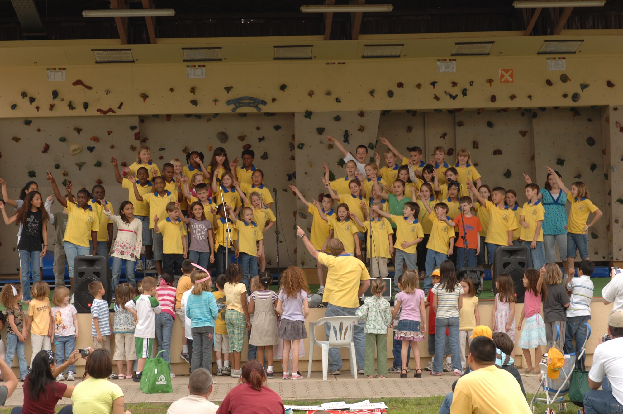 Children from the Incirlik Elementary School Honors Choir sing “Stayin’ Alive” by the Bee Gees during the festivities after the March 22 Easter Egg hunt. The choir sang several songs for the crowd. Other demonstrations included two ballet classes and a dance by a Jazz class. (U.S. Air Force photo by Senior Airman Jason Burton)