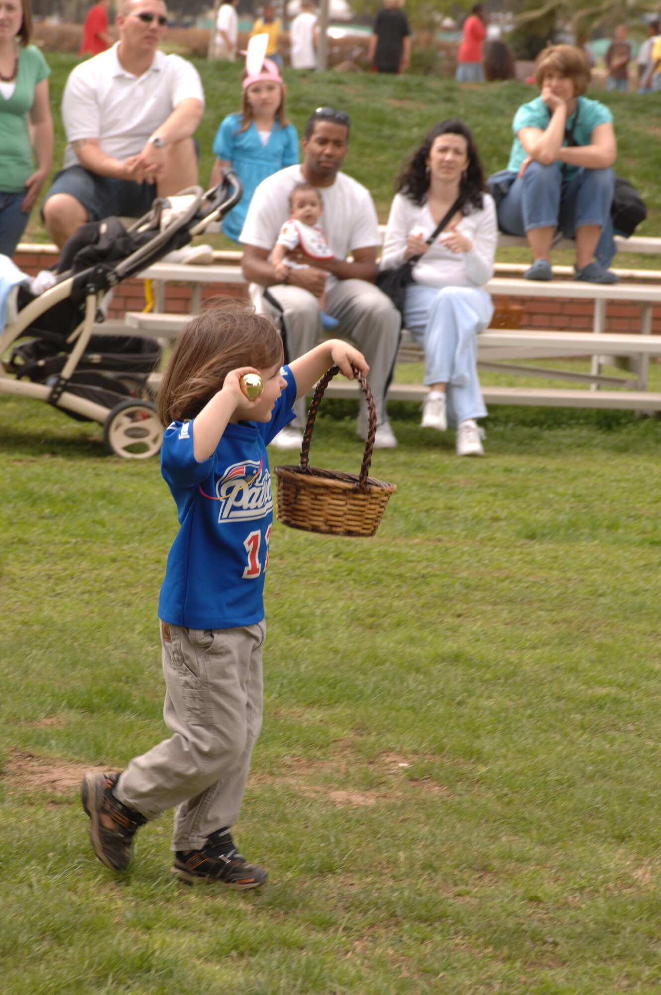 Conner, 4, son of Staff Sgt. Brian Hopkins, 39th Maintenance Squadron, celebrates after discovering the last “Golden Egg.” The Easter Eggs were filled with candy and tickets for a variety of prizes. Conner’s find of the “Golden Egg” earned Conner an Army and Air Force Exchange Service gift certificate. (U.S. Air Force photo by Senior Airman Jason Burton)