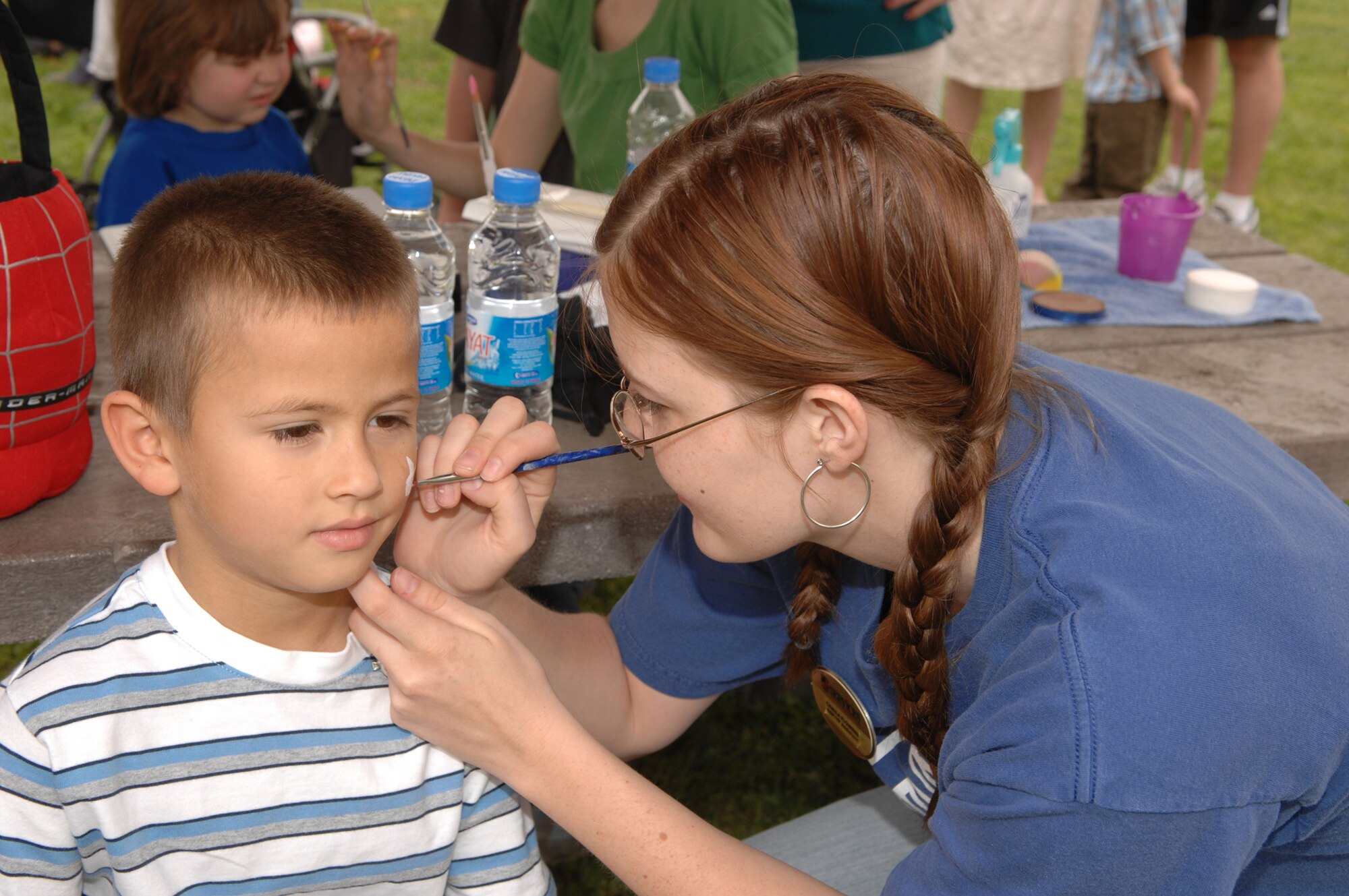 Zachary, 6, son of Staff Sgt. Emmanuel Borbon, 39th Communications Squadron, gets his face painted by Camila Flowers, Youth Center recreation aide, during the base Easter Egg Hunt March 22 at Arkadas Park. The day’s events also included games, music, food and crafts for the children. The Easter Bunny also made an appearance to take photos with the children. (U.S. Air Force photo by Senior Airman Jason Burton)