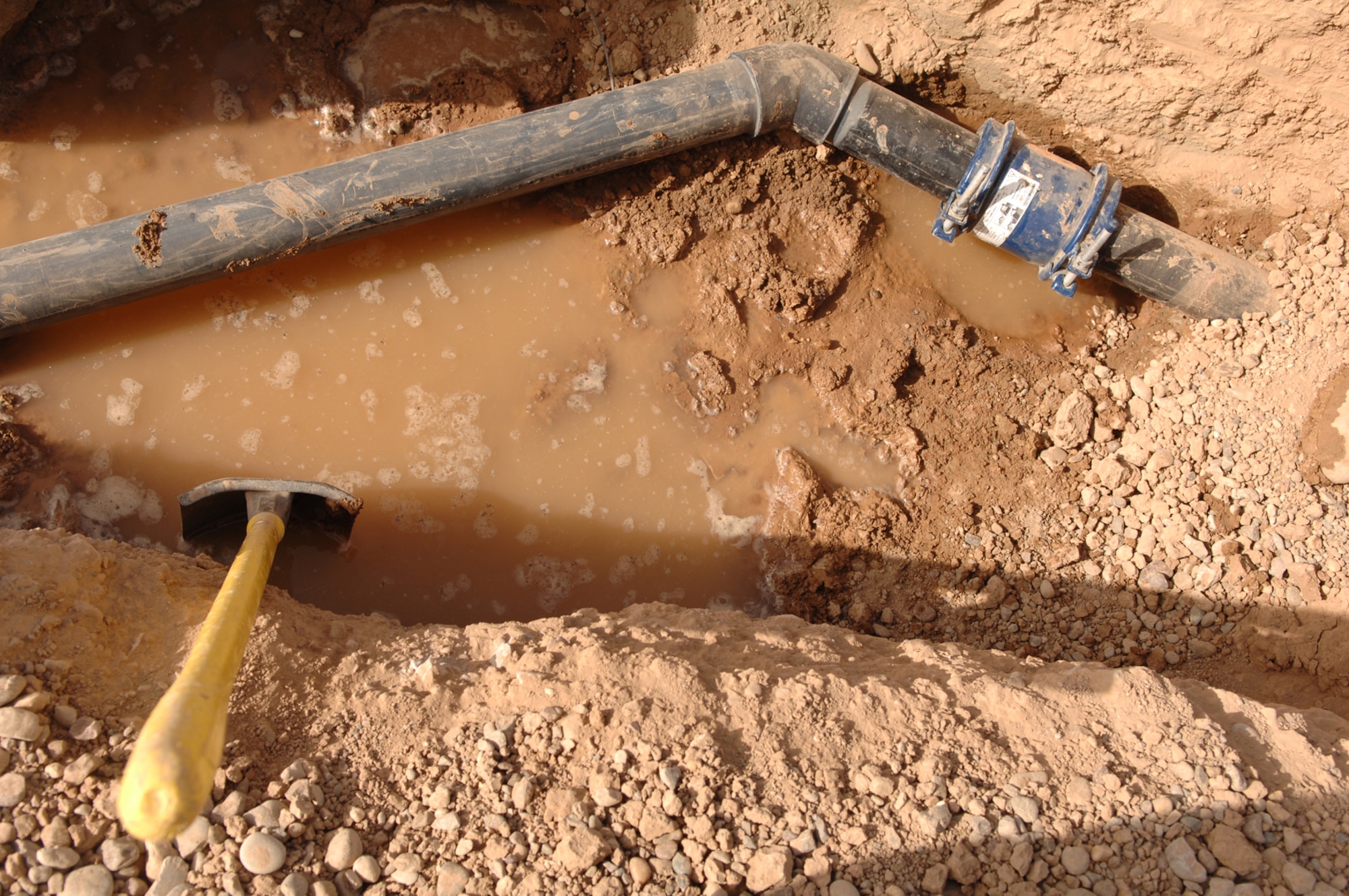 BALAD AIR BASE, Iraq -- The 332nd Civil Engineer Squadron utilities shop is knee- deep in a pipe infrastructure replacement project for the entire Air Force housing area here. The project was started Feb. 11 and is projected to be completed by mid-June. The plumbers are removing old pipe infrastructures and replacing them with newer and thicker gauge pipes that will bring the base to the next echelon of stability. (U.S. Air Force photo/ Senior Airman Julianne Showalter)