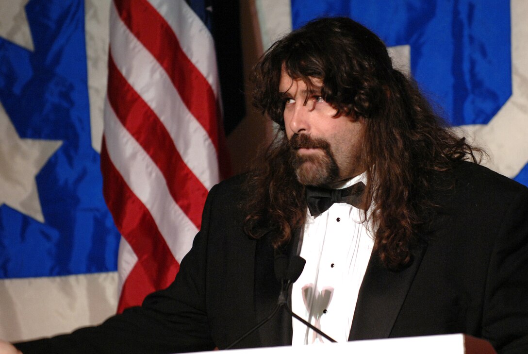Wrestler Mick Foley speaks during the USO Metro awards in Arlington, Va., March 25, 2008. Foley is a frequent visitor to Washington, D.C., area hospitals to visit wounded troops. 