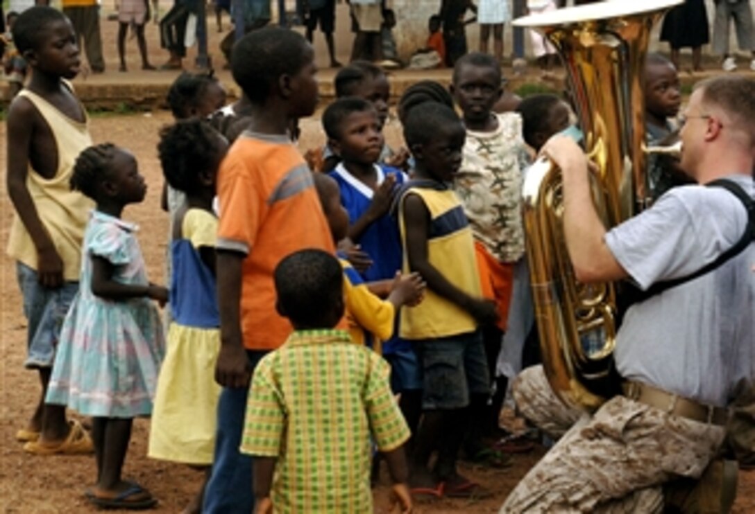 U.S. Marine Sgt. Matthew Heen performs for students, teachers and staff at a secondary school in Buchanon, Liberia, March 23, 2008. Heen is assigned to the U.S. Naval Forces Europe Band, which is participating in an Africa Partnership Station project. 