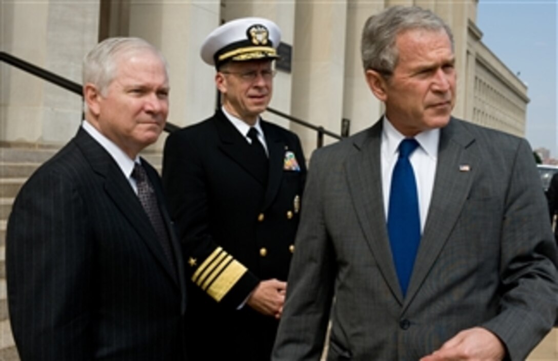 U.S. Defense Secretary Robert M. Gates, left, U.S. Navy Adm. Mike Mullen, chairman of the Joint Chiefs of Staff, center, pause on the steps of the Pentagon with President George W. Bush prior to a meeting on strategy in Iraq, March 26, 2008. 