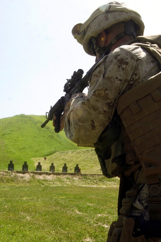 First Lt. Andrew P. Seal sites in his M4 Carbine service rifle at Range 111 here. Marines with the 13th Marine Expeditionary Unit attended a course taught by civilians with I Marine Expeditionary Force, Special Operations Training Group designed to prepare Marines for real life combat scenarios. Seal is the assistant fires officer with the 13th MEU.