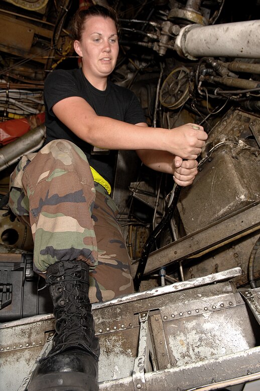 Andersen Air Force Base, Guam -- Airman Alisha Gogocha hand pumps 3,000 pounds per square inch (psi) of air pressure into a B-52's brake March 26 from Andersen Air Force Base, Guam. As a maintainer, Airman Gogocha launches jets, pumps fuel, performs structural inspections, checks tires and marshals aircraft during taxi operations among many other maintanance tasks she is assigned. Airman Gogocha is from the 96th Expeditionary Bomb Squadron deployed from Barksdale AFB, La. (U.S. Air Force photo/Staff Sgt. Vanessa Valentine)