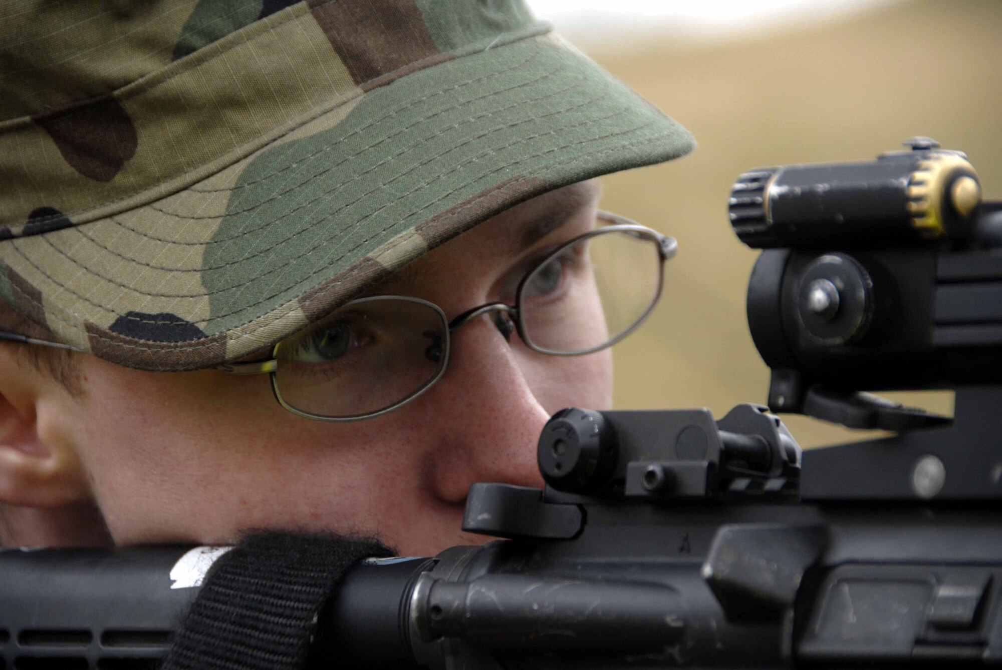 OSAN AIR BASE, Republic of Korea – Airman 1st Class Christopher Reid, 51st Security Forces Squadron entry controller, aims downrange during a designated marksmanship course held March 25. The course helps shooters fire more accurately at great distances. (U.S. Air Force photo/Senior Airman Christopher Boitz)