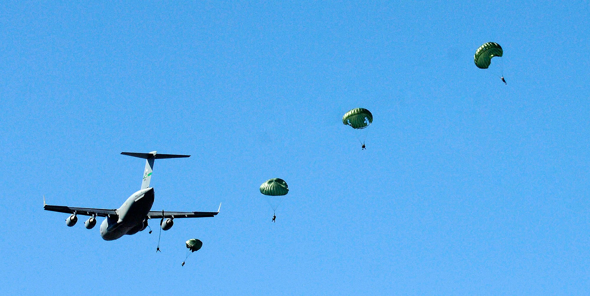 FAIRCHILD AIR FORCE BASE, Wash. – Survival, Evasion, Resistance and Escape School instructors here perform a parachute demonstration for SERE students March 24. The demonstration teaches students to correct parachute procedures during and after bailout. (U.S. Air Force photo / Staff Sgt. JT May III) 