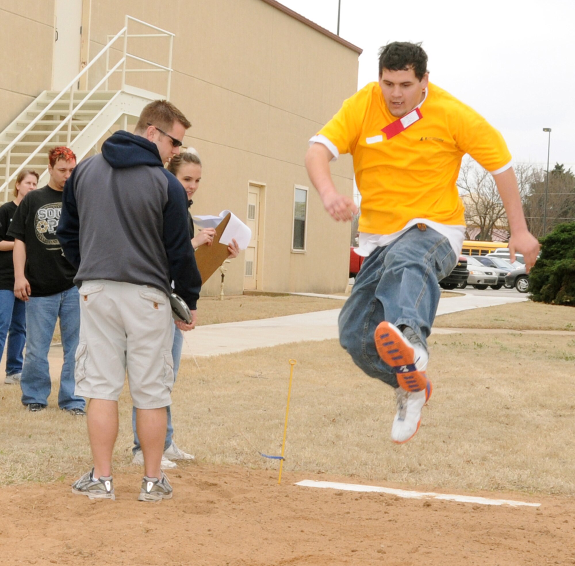 A participant in the 2008 Area Six Special Olympics makes a running long jump attempt March 27 at Vance. This year there was more than 250 Special Olympians between the ages 8 and 82 from Grant, Garfield and Kay counties in Oklahoma participating in the day’s activities.  Competitions were held in track, field and wheelchair athletics.  Track athletics included wheelchair races, 25-meter walk and the 1-mile run. Field athletics included the shot put, softball throw, safety javelin and the long jump. Team Vance and the local community came together once again to ensure a memorable day of competition, camaraderie and fun for these very special athletes. 