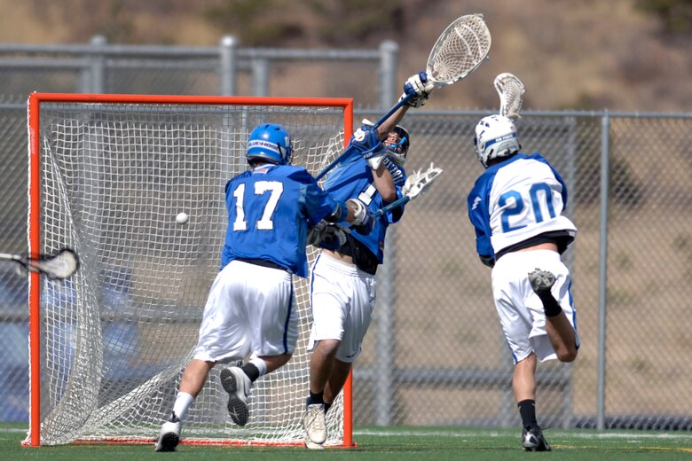 Air Force Academy senior Chris Tubesing scores his second goal of the day March 25 as Air Force defeated Presbyterian College 12-4 at the Cadet Lacrosse Stadium in Colorado Springs, Colo.  The Falcons, undefeated at home, move to 2-4 on the season.  (U. S. Air Force photo/David Armer)