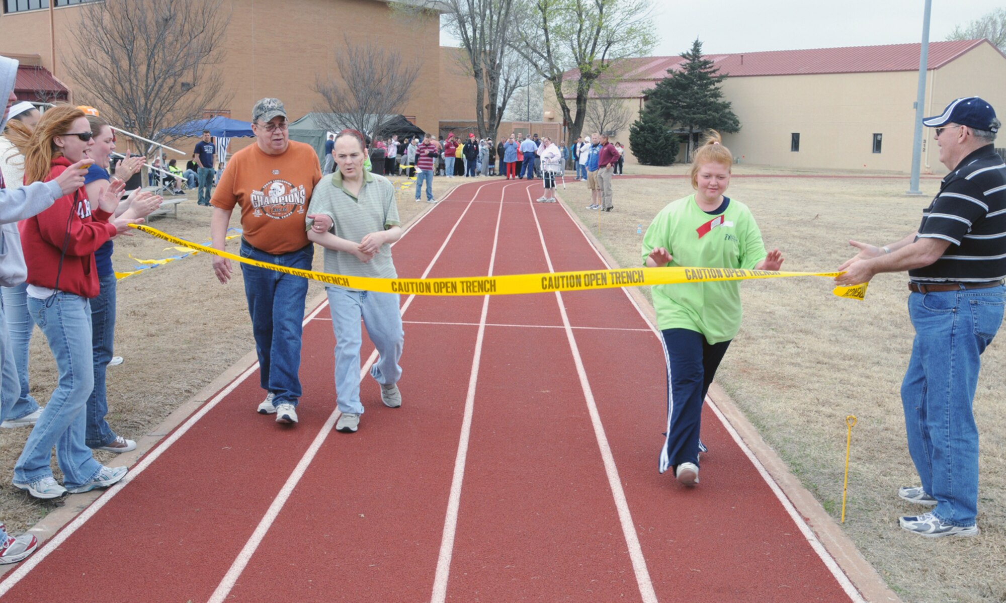 Participants in the 2008 Area Six Special Olympics cross the finish line March 27 at Vance. This year there was more than 250 Special Olympians between the ages 8 and 82 from Grant, Garfield and Kay counties in Oklahoma participating in the day’s activities.  Competitions were held in track, field and wheelchair athletics.  Track athletics included wheelchair races, 25-meter walk and the 1-mile run. Field athletics included the shot put, softball throw, safety javelin and the long jump. Team Vance and the local community came together once again to ensure a memorable day of competition, camaraderie and fun for these very special athletes. 