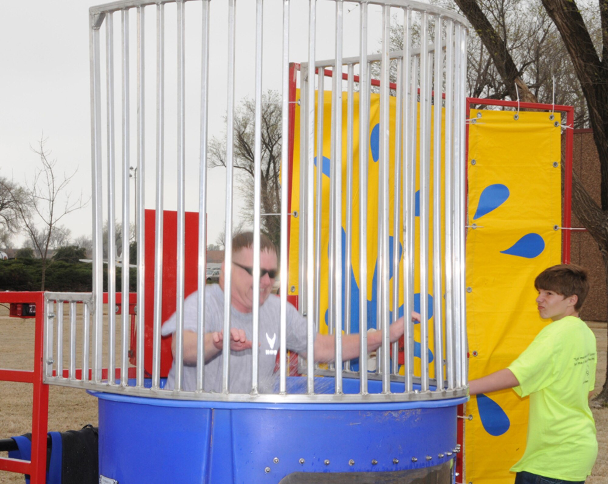 Chaplain (Lt. Col.) Michael Gilbert is dunked during festivities for the 2008 Area Six Special Olympics March 27 at Vance. This year there was more than 250 Special Olympians between the ages 8 and 82 from Grant, Garfield and Kay counties in Oklahoma participating in the day’s activities.  Competitions were held in track, field and wheelchair athletics.  Track athletics included wheelchair races, 25-meter walk and the 1-mile run. Field athletics included the shot put, softball throw, safety javelin and the long jump. Team Vance and the local community came together once again to ensure a memorable day of competition, camaraderie and fun for these very special athletes. 