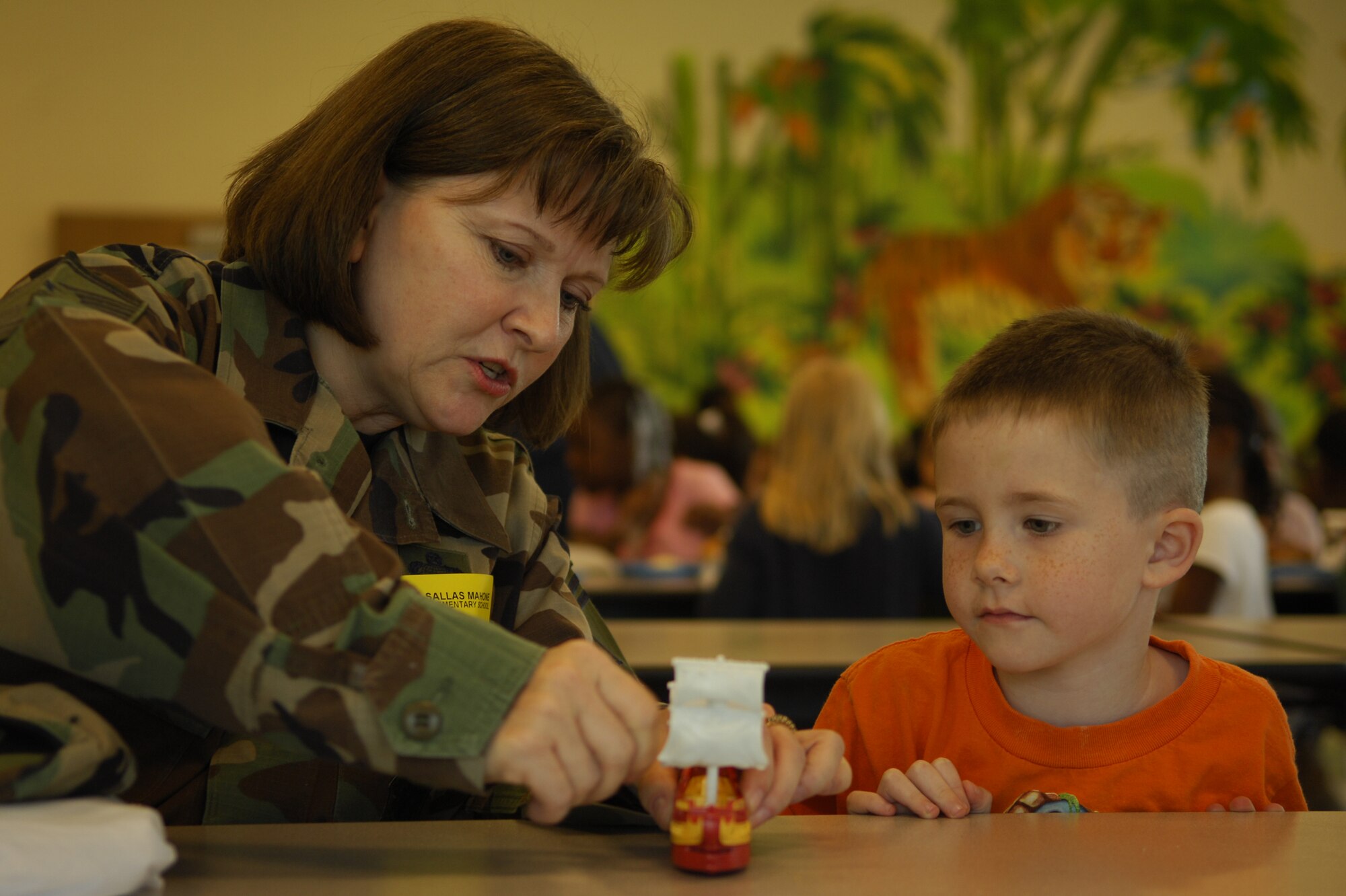MOODY AIR FORCE BASE, Ga. -- Senior Master Sgt. Monica Potts, 23rd Force Support Squadron, enjoys a lunch-visit with Corigen Vokctsek, a student at the Sallas Mahone Elementary School, March 27 as part of the Scott Craven Mentoring Program.  Sergeant Potts mentors children with deployed parents, to provide them with adult companionship.  (U.S. Air Force photo by Senior Airman Elizabeth Rissmiller) 