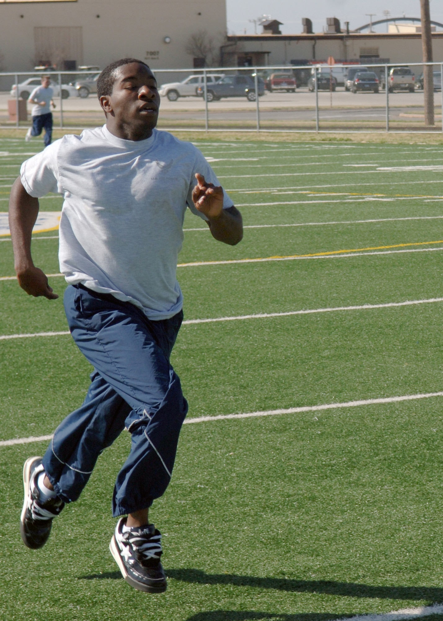 DYESS AIR FORCE BASE, Texas -- Airman Basic Jeffrey Pitts sprints during physical training March 26. FTAC Airmen PT on a regular basis to keep physically fit for future squadron PT. (U.S. Air Force Photo by Airman 1st Class Micheal Breaux)
