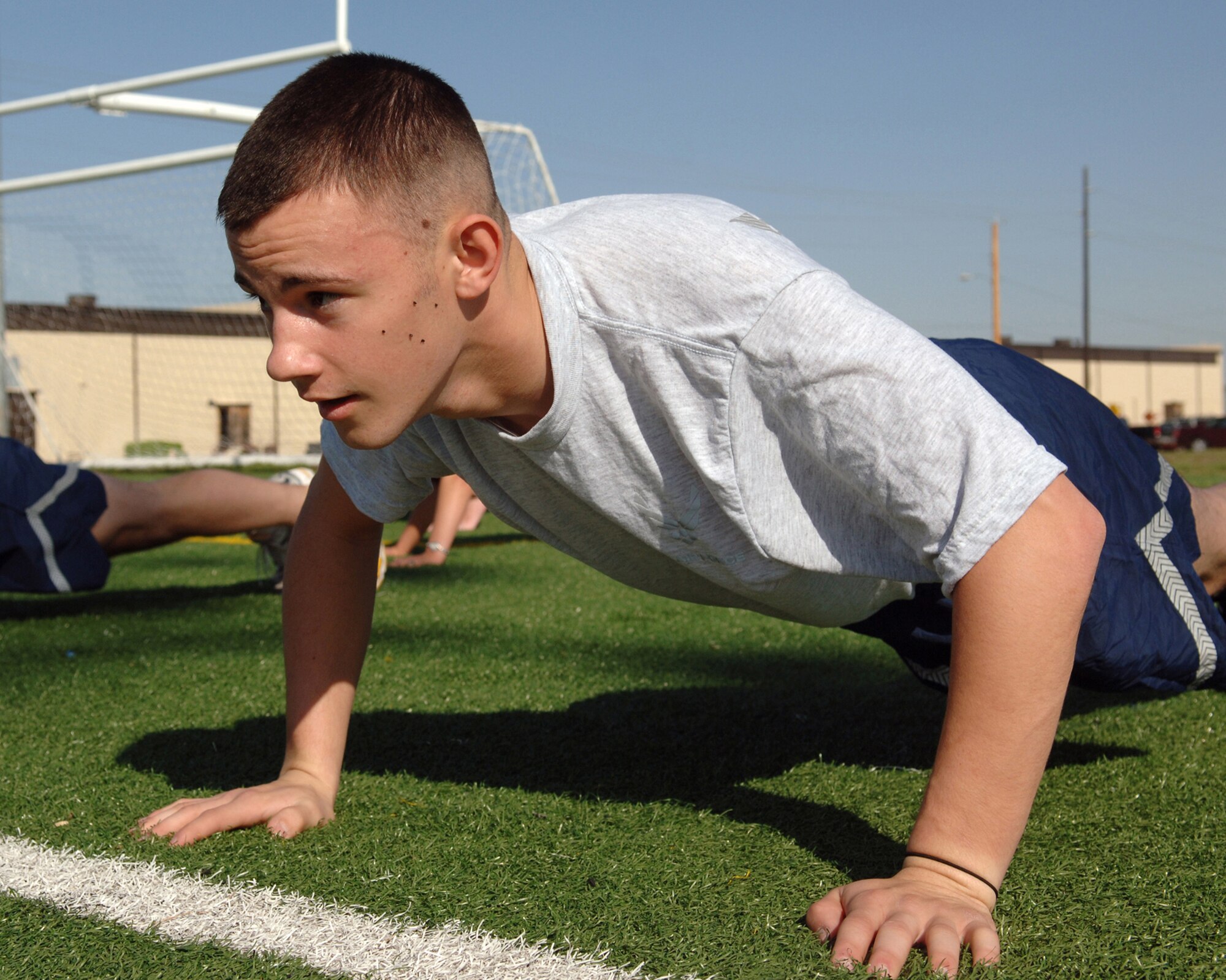 DYESS AIR FORCE BASE, Texas -- Airman 1st Class Bryan Murray engages in physical training during the First Term Airman Center course, Mar. 26. FTAC Airmen go through rigorous fitness to keep them in shape for their future squadrons.   (U.S. Air Force Photo by Airman 1st Class Micheal Breaux)