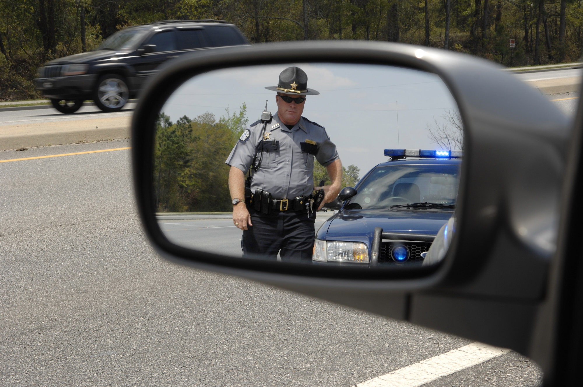 MOODY AIR FORCE BASE, Ga. – Deputy Raymond Devogt, Lowndes County Sheriff’s deputy, pulls over a speeding driver on Bemiss Road here March 27.  Deputy Devogt ensures that Bemiss Road motorists follow the rules of the road. (U.S. Air Force photo by Senior Airman Angelita Lawrence)