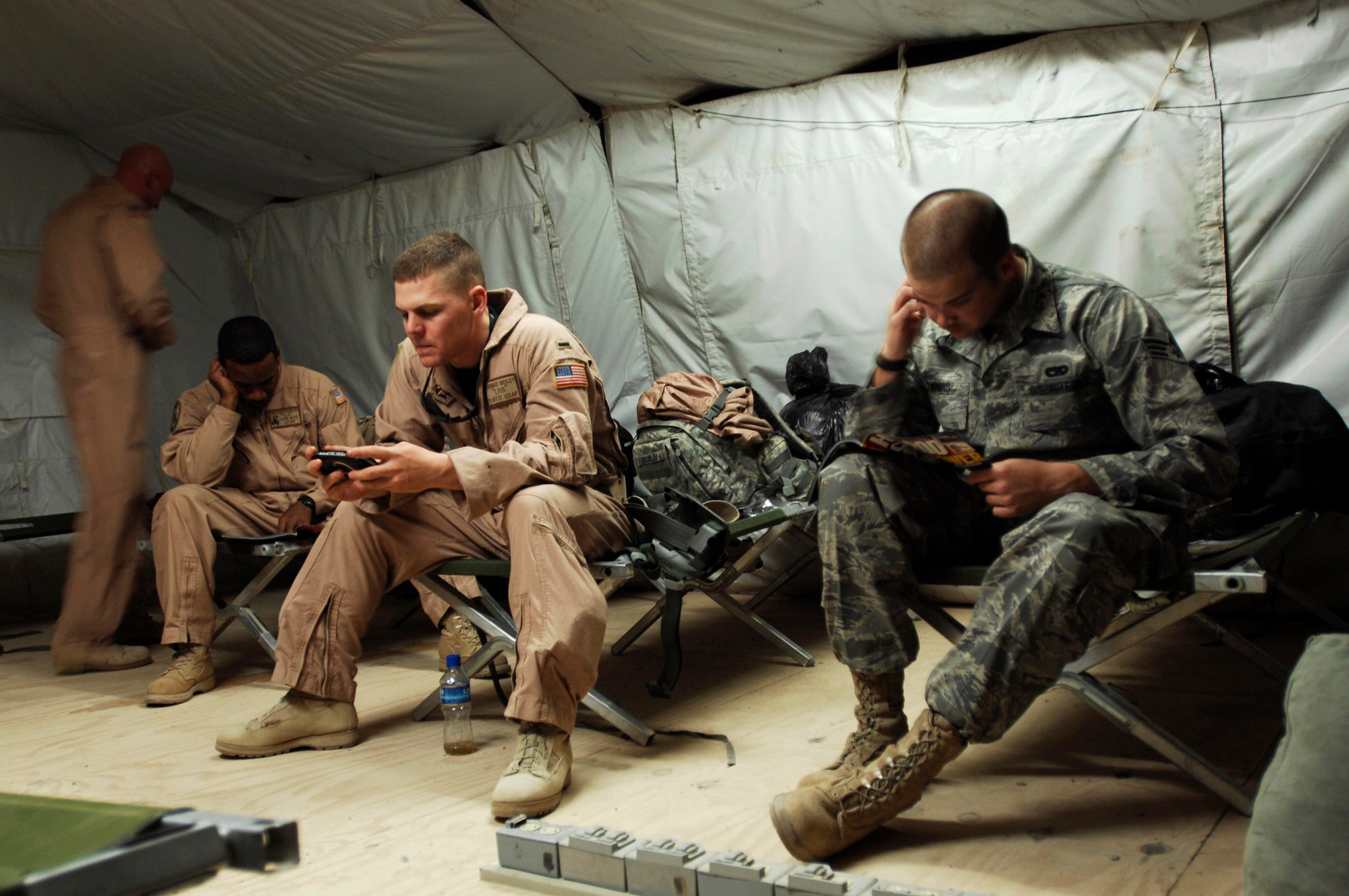 Airmen from the 586th Expeditionary Logistics Readiness Squadron, 70th Medium Truck Detachment rest and relax before starting the next leg of a recent convoy from an Army camp in Southwest Asia. The Airmen of the 70th and 424th MTDs assigned to the 586th ELRS are in-lieu-of forces supporting the Army support line-haul convoy movements in and out of Iraq. (U.S. Air Force photo/Staff Sgt. Patrick Dixon) 
