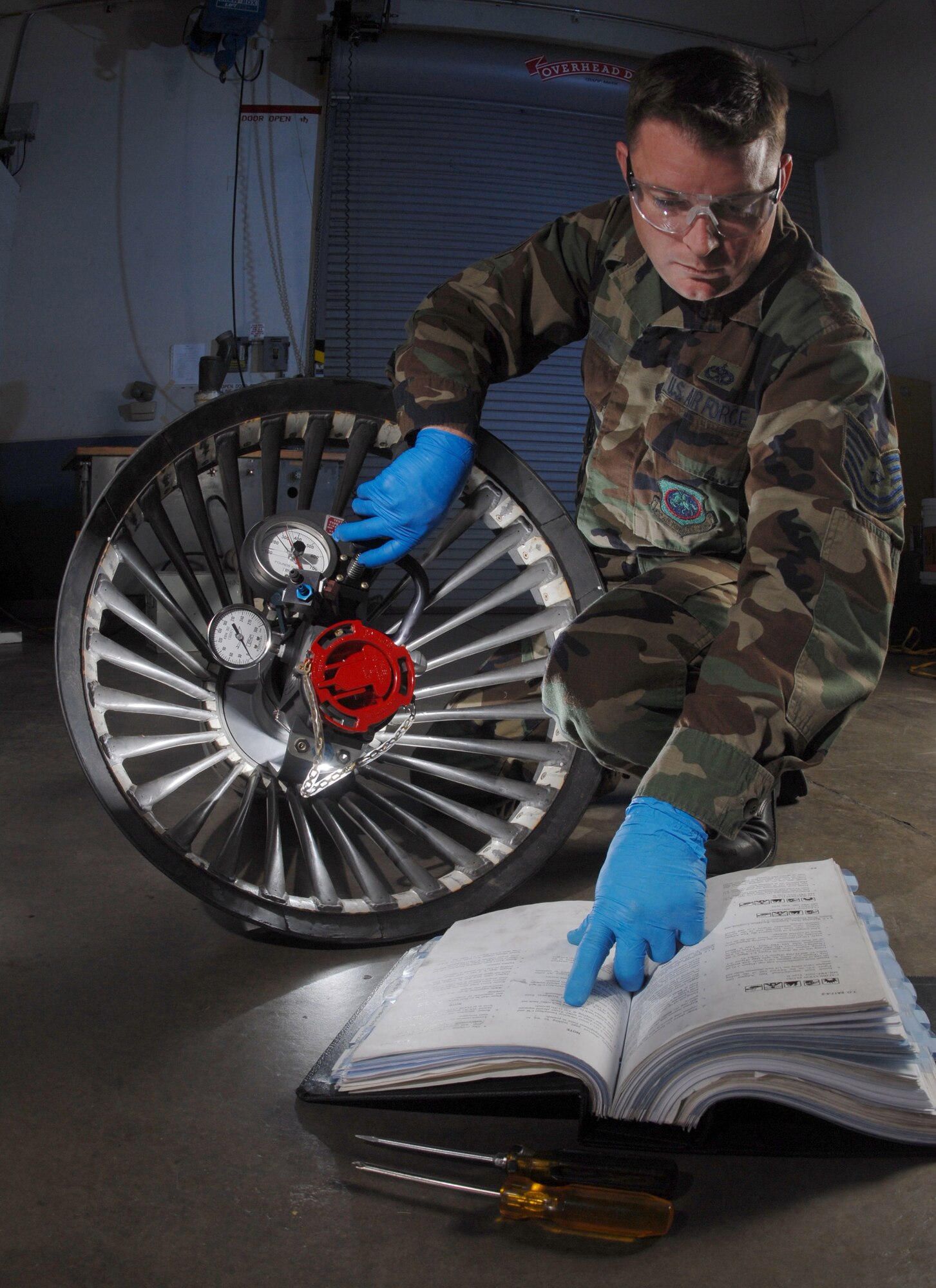 Tech. Sgt. Christopher Walls uses a breakaway force tester March 25 on a KC-135 Stratotanker aerial refueling drogue.  He is with the 452nd Maintenance Squadron's aircraft pneudraulics systems shop at March Air Reserve Base, Calif.  March ARB, located in Southern California, is home to the largest air mobility wing in the Air Force Reserve Command. (U.S. Air Force photo/Val Gempis)
