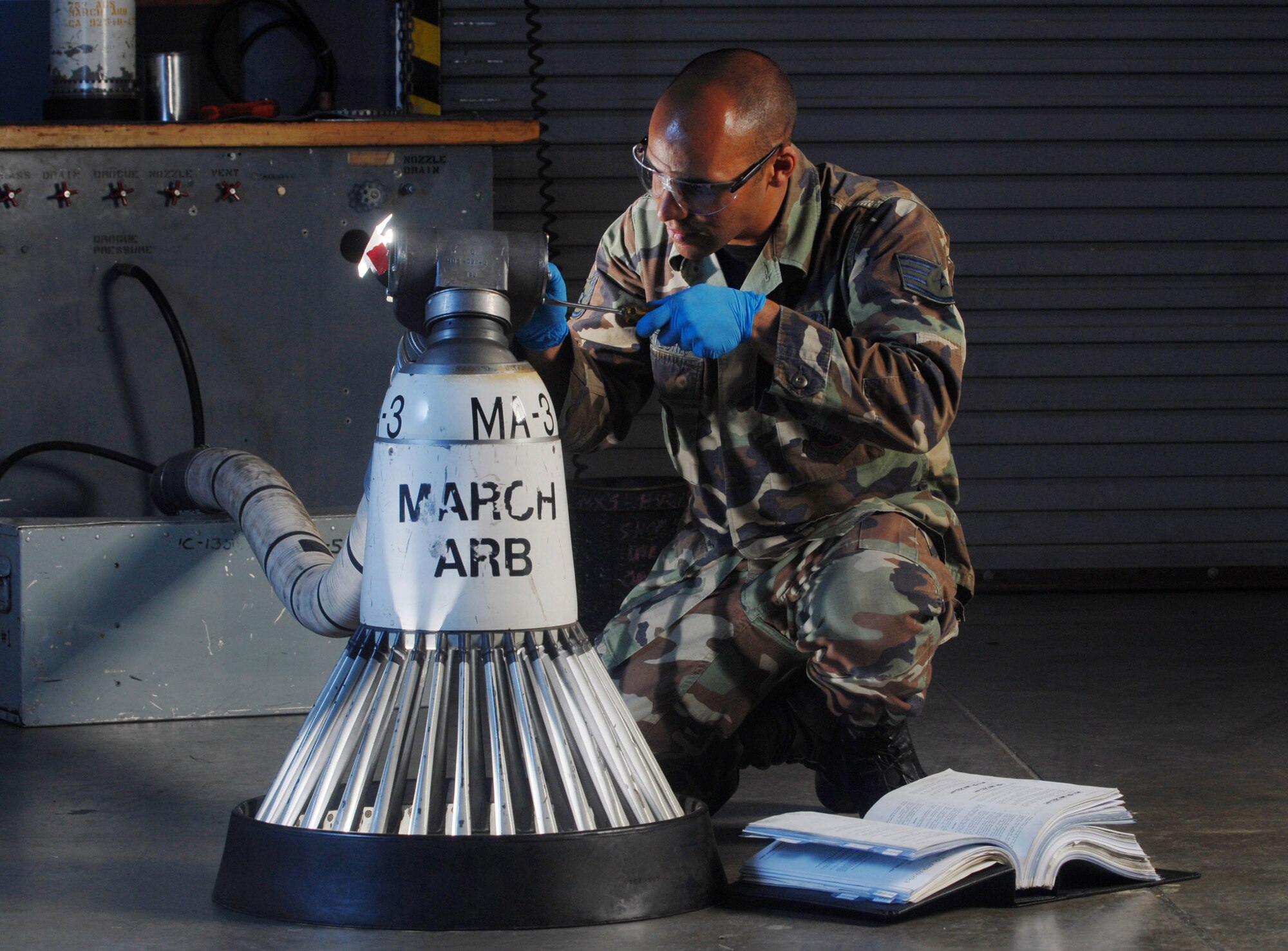Staff Sgt. Chris Wietecha conducts a pressurization test March 25 on a KC-135 Stratotanker aerial refueling drogue. He is with the 452nd Maintenance Squadron's aircraft pneudraulics systems shop at March Air Reserve Base, Calif.  March ARB, located in Southern California, is home to the largest air mobility wing in the Air Force Reserve Command. (U.S. Air Force photo/Val Gempis)