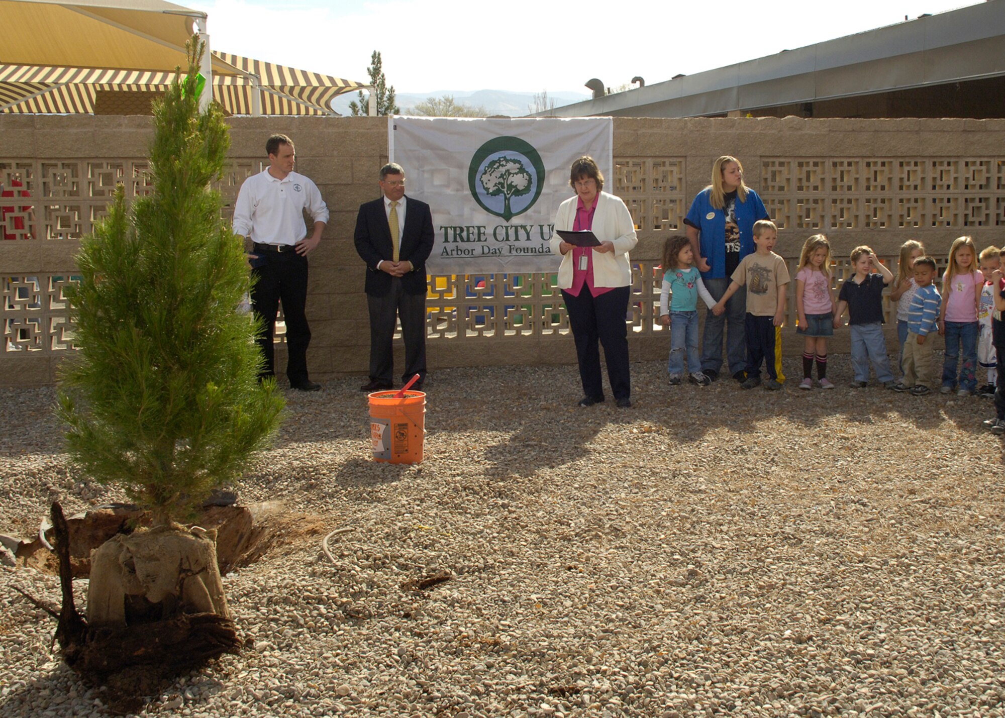 Deborah Hartell, 49th Civil Engineer Squadron environmental flight chief, reads the Arbor Day proclamation from Col. Jeff Harrigian, 49th Fighter Wing commander, March 26, 2008, at Holloman Air Force Base, N.M. Holloman celebrated the trees on the base's living environment and the retention of the designation "Tree City USA". (U.S. Air Force photo/Airman 1st Class Michael J. Means)