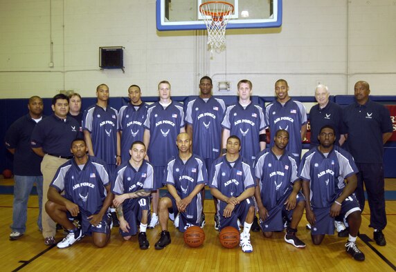 The All-Air Force Basketball Team poses at the Fitness Center at Dover Air Force Base. (Back, left to right) Paul Mayberry, assistant coach, David Pena, trainer, Eddie Goad, project officer, Marico Gray, Nick Welch, Bernard James, Jacob Butschi, Wayne Wooley, Ted Albers, assistant coach, John Bailey, head coach and C-17 produc directorate program manager at Robins AFB, Ga. (Front, left to right) Jammar Major, Ricardo Bachelor, Kurtis Darden, Drew Colen, James Lewis, Dan Nwaelele. (U.S. Air Force photo/Airman 1st Class Shen-Chia Chu)
