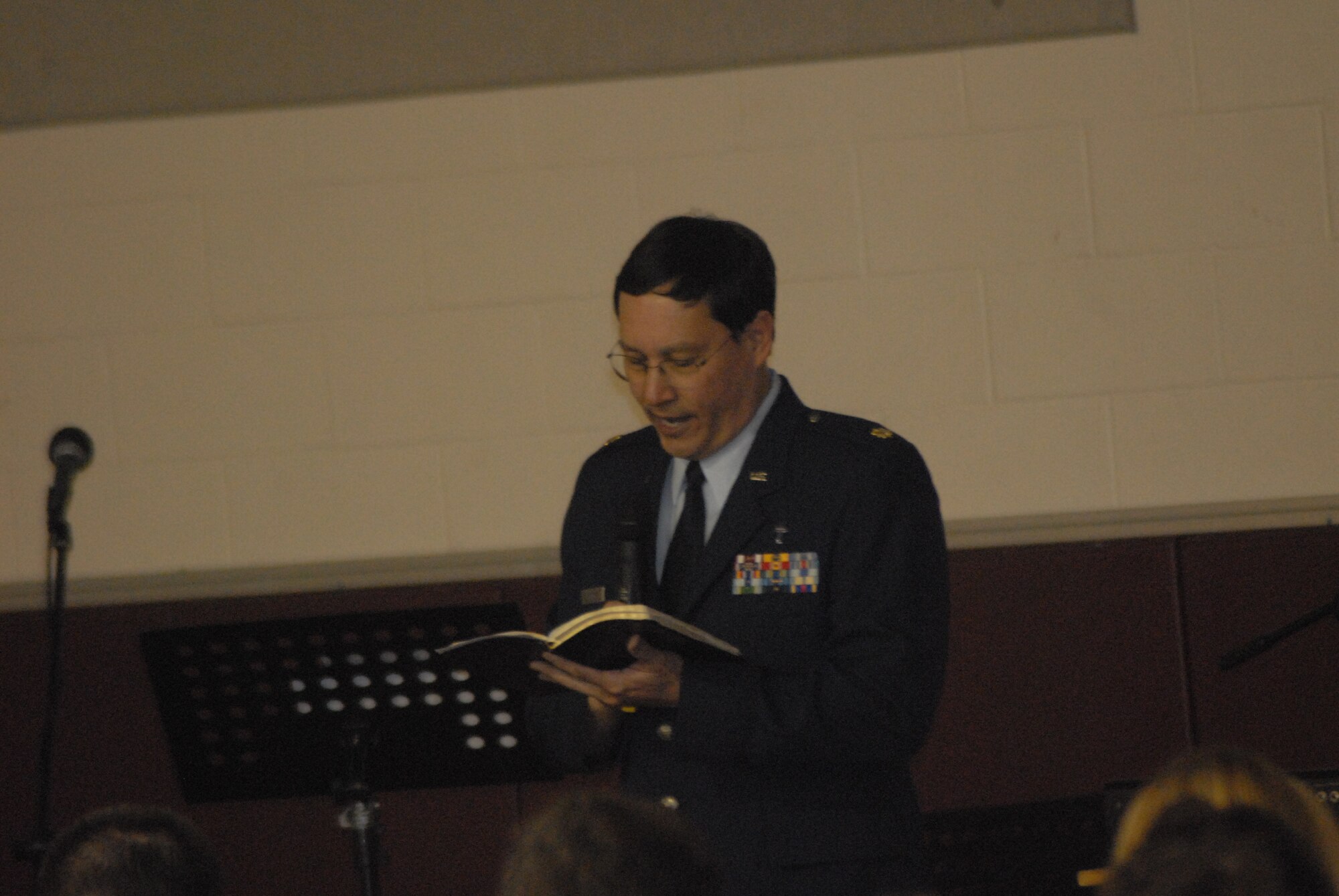 Chaplain (Maj.) Kenneth Reyes, 43rd Airlift Wing, reads the Scripture during the joint sunrise service for Fort Bragg and Pope members March 23 at the Tolson Youth Center on Fort Bragg. 