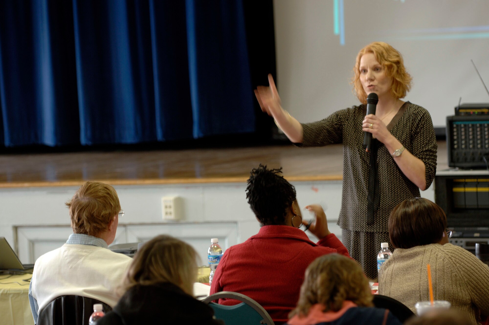 LANGLEY AIR FORCE BASE, Va. -- Dr. Candice Monson, Veterans Affairs National Center for Post Traumatic Stress Syndrome women’s health services division deputy director, speaks to mental health professionals at the Langley Community Center March 27. Professionals from Langley, the Hampton VA Hospital, Portsmouth Naval Hospital, Norfolk substance abuse program, Fort Lee, Va., and Seymour Johnson Air Force Base, N.C., attended the three-day conference, which covered a variety of topics regarding PTSD. The conference focused on cognitive processing therapy, an approach to helping PTSD patients, which is geared toward servicemembers who are at high risk for trauma. (U.S. Air Force photo/Airman 1st Class Chase Skylar DeMayo)
