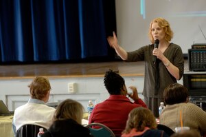 LANGLEY AIR FORCE BASE, Va. -- Dr. Candice Monson, Veterans Affairs National Center for Post Traumatic Stress Syndrome women’s health services division deputy director, speaks to mental health professionals at the Langley Community Center March 27. Professionals from Langley, the Hampton VA Hospital, Portsmouth Naval Hospital, Norfolk substance abuse program, Fort Lee, Va., and Seymour Johnson Air Force Base, N.C., attended the three-day conference, which covered a variety of topics regarding PTSD. The conference focused on cognitive processing therapy, an approach to helping PTSD patients, which is geared toward servicemembers who are at high risk for trauma. (U.S. Air Force photo/Airman 1st Class Chase Skylar DeMayo)