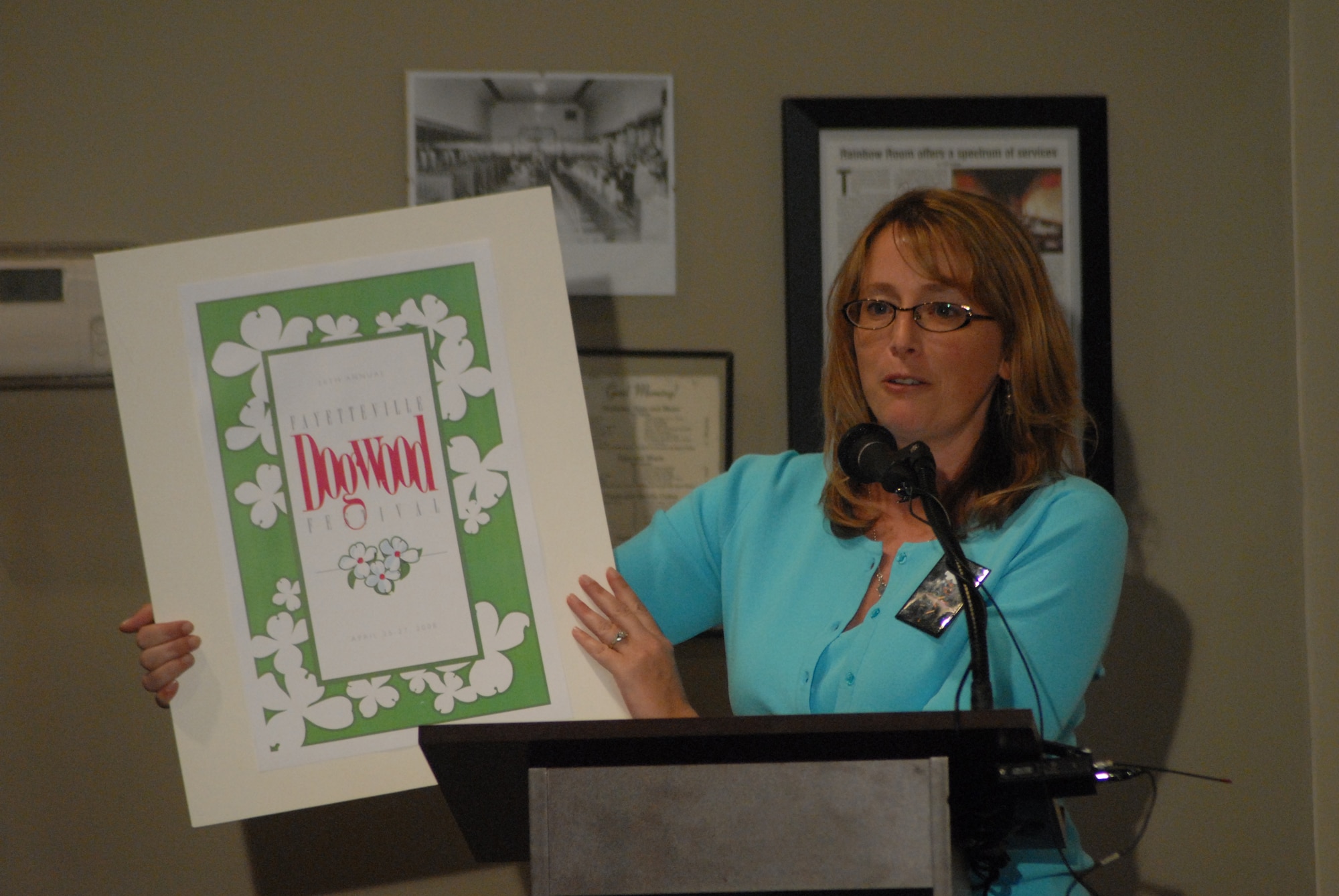Carrie King, executive director for the Dogwood Festival, shows off the new t-shirt design for the 2008 Fayetteville Dogwood Festival which begins April 25 in downtown Fayetteville. (U.S. Air Force Photo by Staff Sgt. Jon LaDue)
