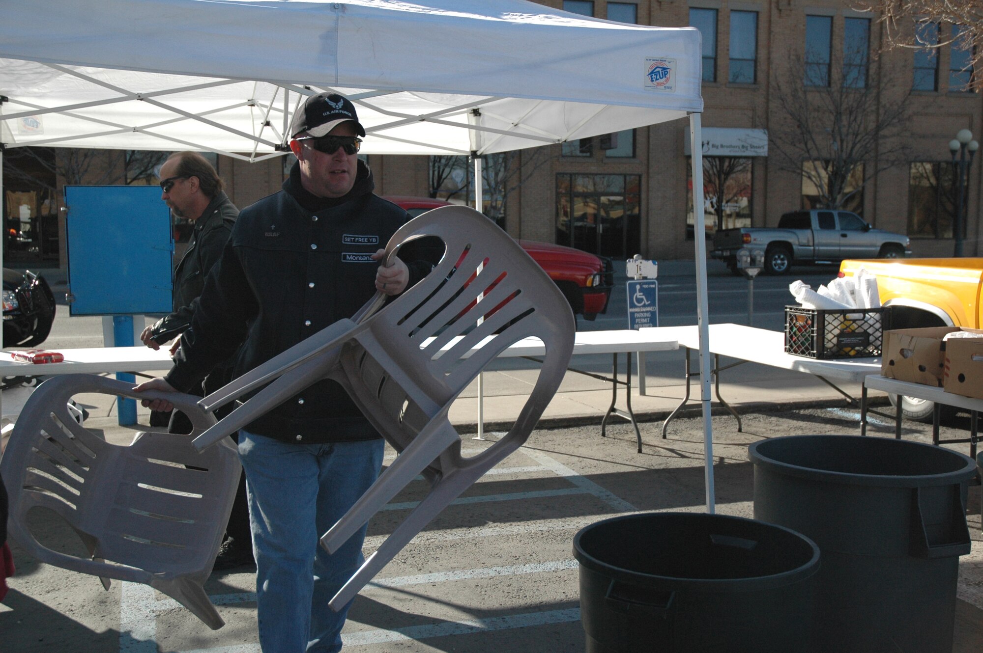 Master Sgt. Kevin Carter, 341st Civil Engineer Squadron, sets up chairs prior to a cook-off for needy and homeless members of the Great Falls community. The cook-off was held March 22 and was followed by an Easter service sponsored by the Servants for Christ. They will be holding a cook-off each Saturday through summer starting at 5 p.m. at the corner of 1st Ave. N and 6th St. Individuals interested in volunteering can contact JT Coughlan at 453-4479.