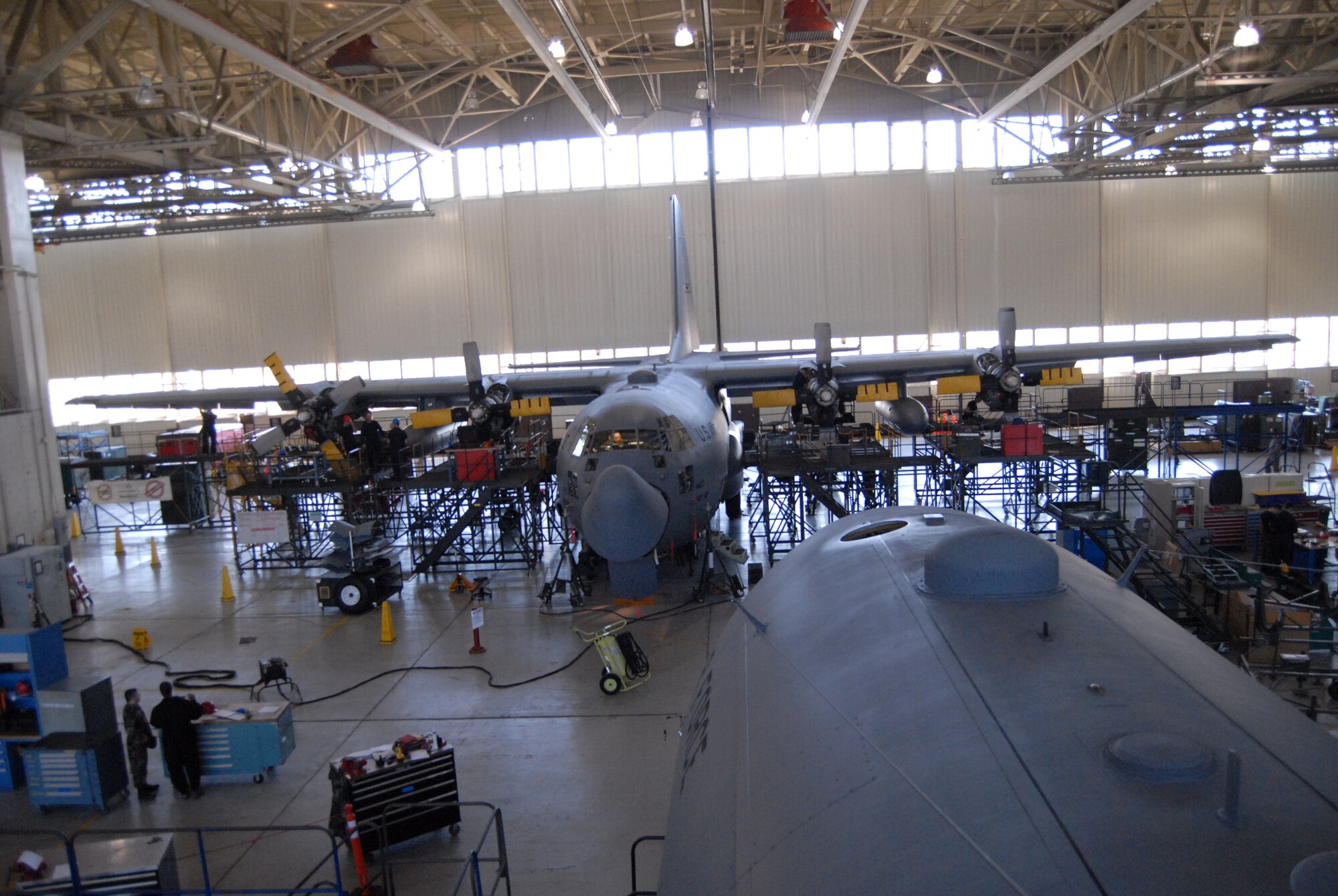 A 440th Airlift Wing C-130H is repaired in Hangar 4 at Pope Air Force Base, N.C. March 17. (U.S. Air Force Photo by 2nd Lt. Chris Hoyler)