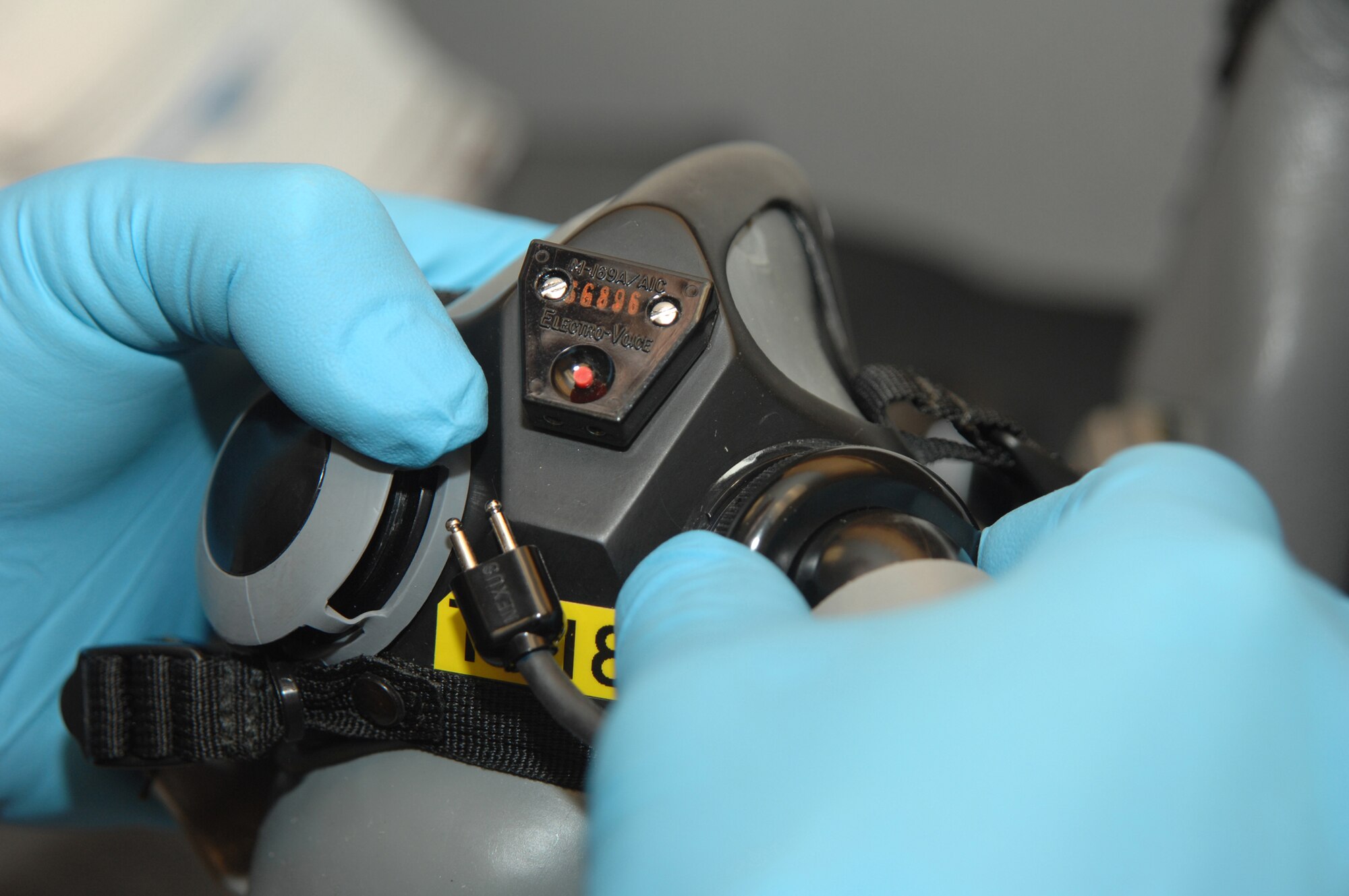 WHITEMAN AIR FORCE BASE, Mo. - Senior Airman Erick Hall, 393rd Bomb Squadron, Aircrew Flight Equipment specialist inspects a MBU20/P mask. Masks are inspected every 30 days for damage. Aircrew Flight Equipment Specialist’s are capable of making repairs to equipment as needed.  (U.S. Air Force Photo/ Senior Airman Jessica Snow)