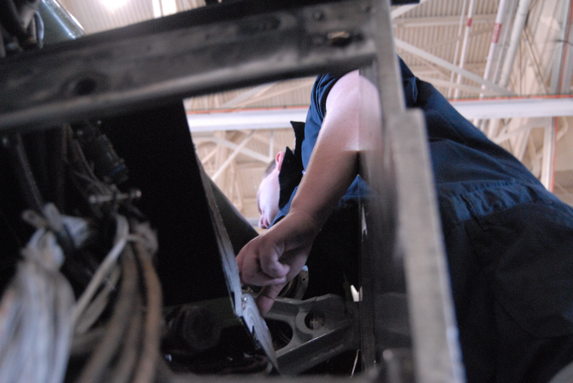 Staff Sgt. Wendell Bond, 43rd Maintenance Squadron, works on a truss mount change on a C-130 E-model plane March 17. (U.S. Air Force Photo by 2nd Lt. Chris Hoyler)