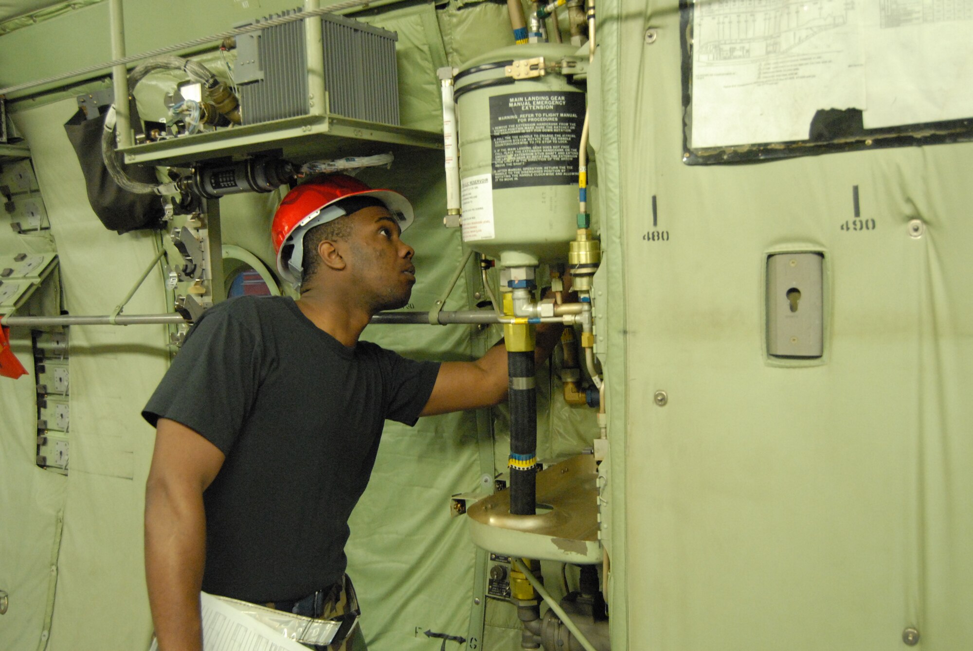Staff Sgt. Eric Carr, 43rd Maintenance Squadron, inspects a 440th Airlift Wing C-130H March 17 as part of the preliminary inspection phase on the aircraft. (U.S. Air Force Photo by 2nd Lt. Chris Hoyler)