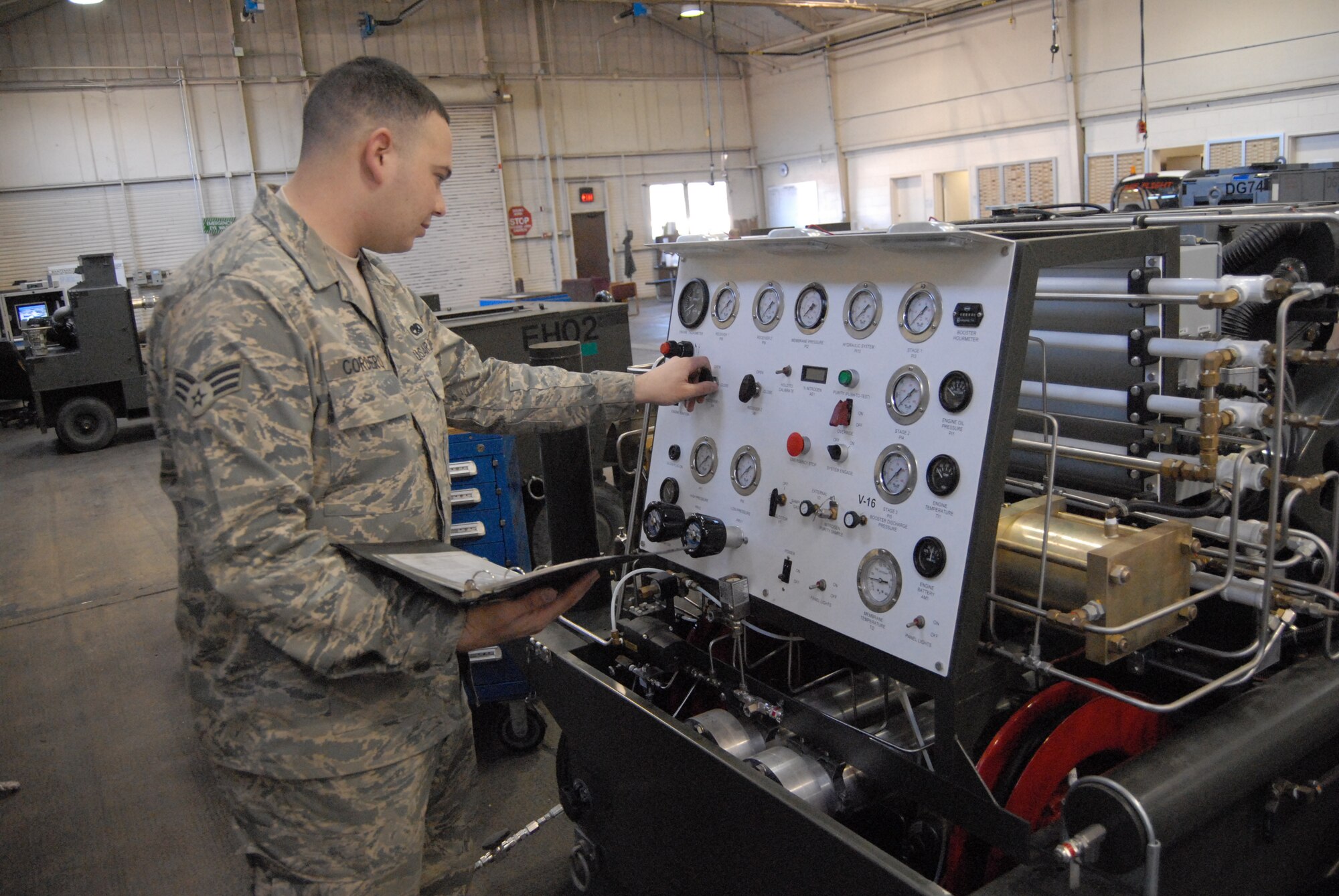 Senior Airman Joseph Cordero, 43rd Maintenance Squadron, inspects the self-generating nitrogen servicing cart March 24. The machine takes nitrogen to service aircraft. (U.S. Air Force Photo by 2nd Lt. Chris Hoyler)