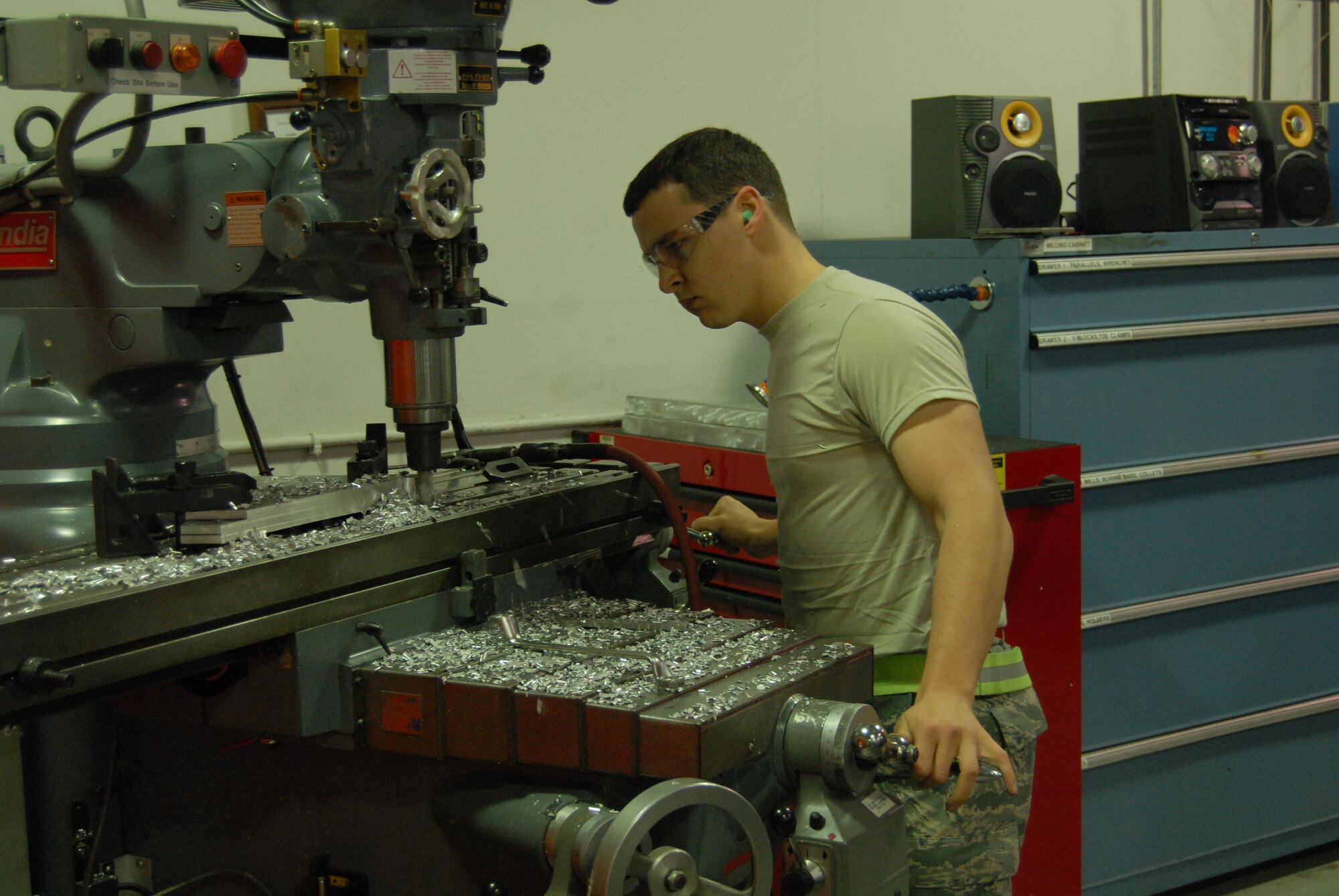 Senior Airman Luke Arnold, 43rd Maintenance Squadron, uses a mill to fabricate parts in the metals shop March 24. (U.S. Air Force Photo by 2nd Lt. Chris Hoyler)